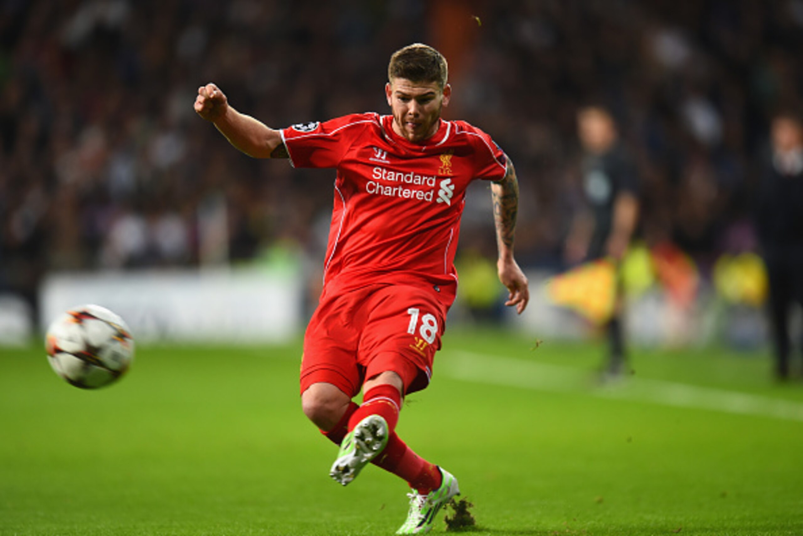 MADRID, SPAIN - NOVEMBER 04:  Alberto Moreno of Liverpool kicks the ball during the UEFA Champions League Group B match between Real Madrid CF and Liverpool FC at Estadio Santiago Bernabeu on November 4, 2014 in Madrid, Spain.  (Photo by Shaun Botterill/G