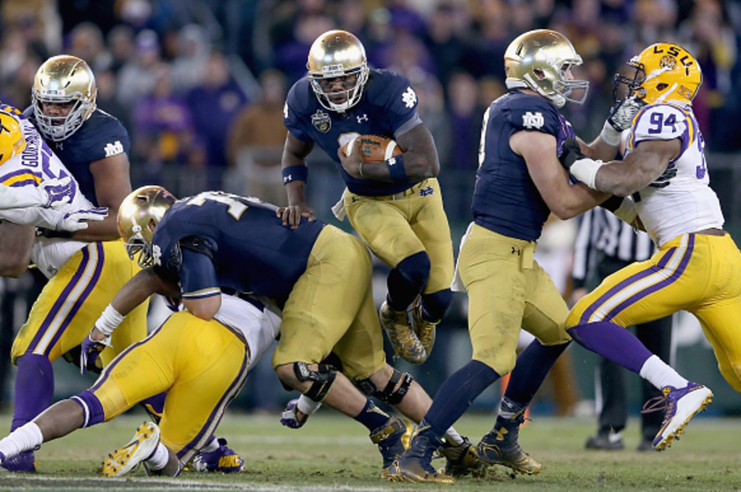 NASHVILLE, TN - DECEMBER 30:  Malik Zaire #8 of the Notre Dame Fighting Irish runs with the ball on the game winning drive in the fourth quarter against the LSU Tigers in the Franklin American Mortgage Music City Bowl at LP Field on December 30, 2014 in N