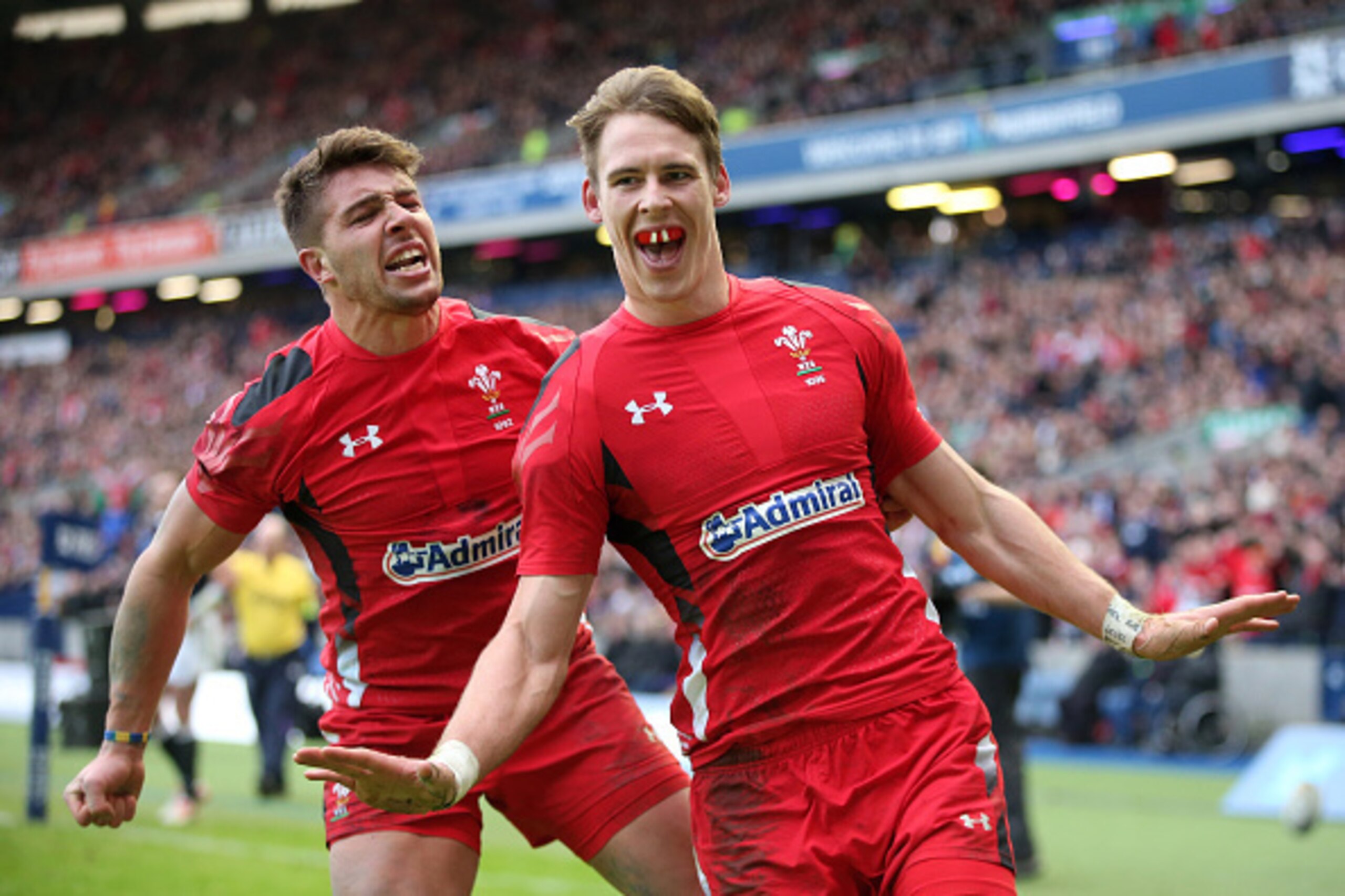 EDINBURGH, SCOTLAND - FEBRUARY 15:  Liam Williams of Wales celebrates scoring a try with teammate Rhys Webb of Wales, but Referee Glen Jackson of New Zealand rules it out after consulting the Television Match Official during the RBS Six Nations match betw