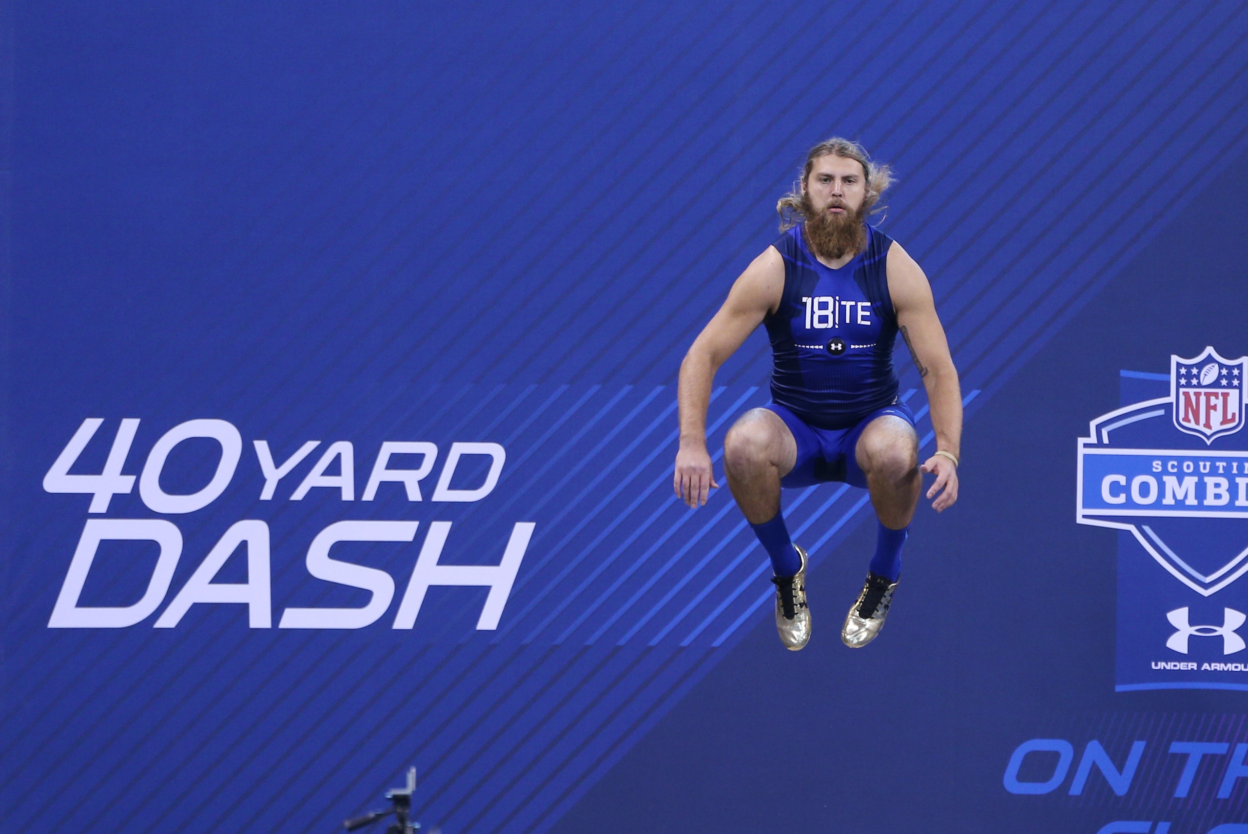 Feb 20, 2015; Indianapolis, IN, USA; UTEP tight end Eric Tomlinson jumps up to loosen his legs before running the 40 yard dash during the 2015 NFL Combine at Lucas Oil Stadium. Mandatory Credit: Brian Spurlock-USA TODAY Sports
