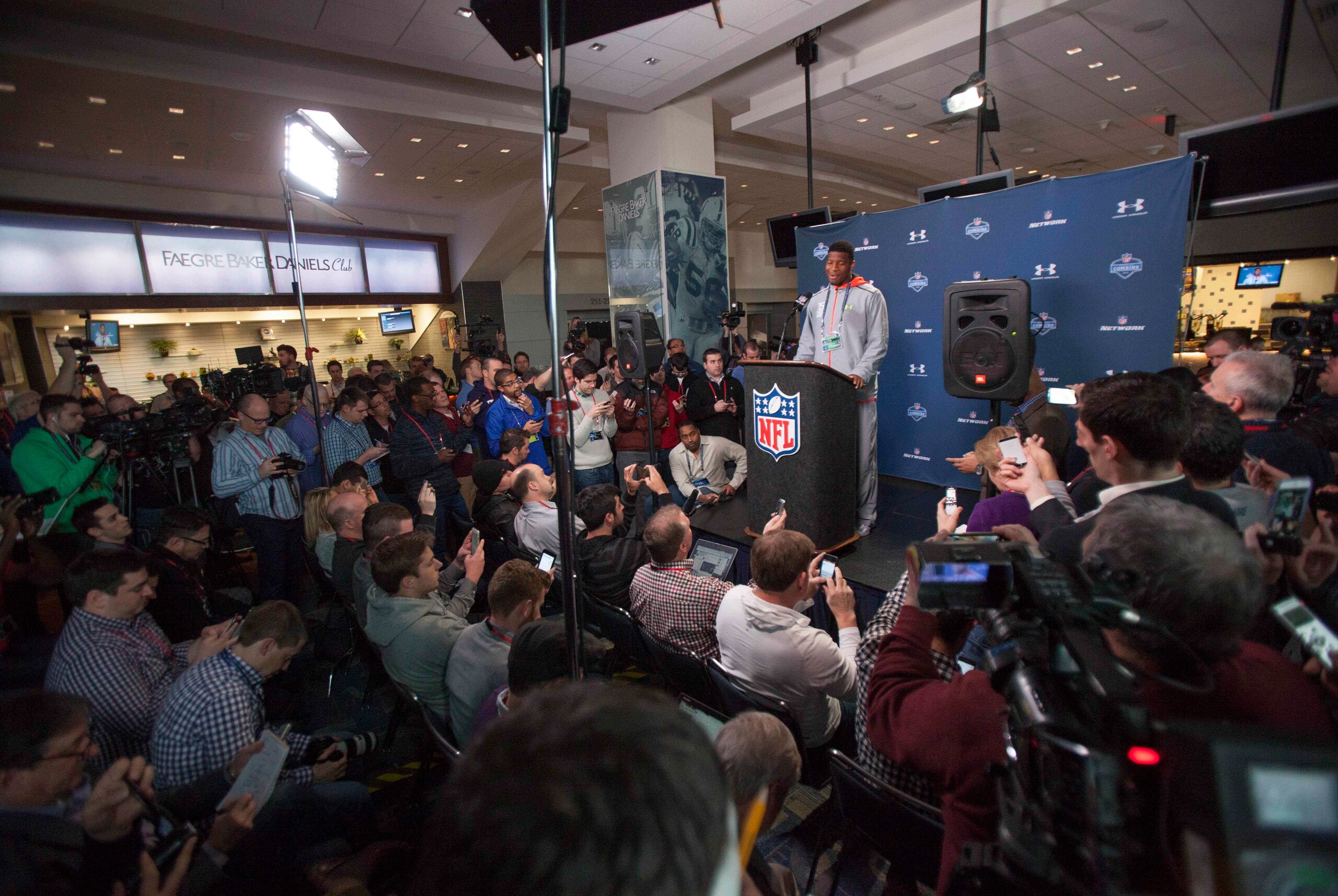 Feb 20, 2015; Indianapolis, IN, USA; Florida State quarterback Jameis Winston (C) speaks to the media at the 2015 NFL Combine at Lucas Oil Stadium. Mandatory Credit: Trevor Ruszkowski-USA TODAY Sports