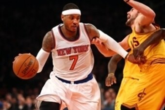 Dec 4, 2014; New York, NY, USA; New York Knicks small forward Carmelo Anthony (7) controls the ball against Cleveland Cavaliers power forward Kevin Love (0) during the fourth quarter at Madison Square Garden. The Cavaliers defeated the Knicks 90-87. Manda