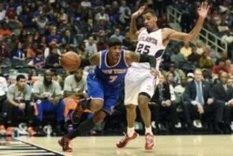 Nov 8, 2014; Atlanta, GA, USA; New York Knicks forward Carmelo Anthony (7) drives to the basket against Atlanta Hawks guard Thabo Sefolosha (25) during the first half at Philips Arena. Mandatory Credit: Dale Zanine-USA TODAY Sports