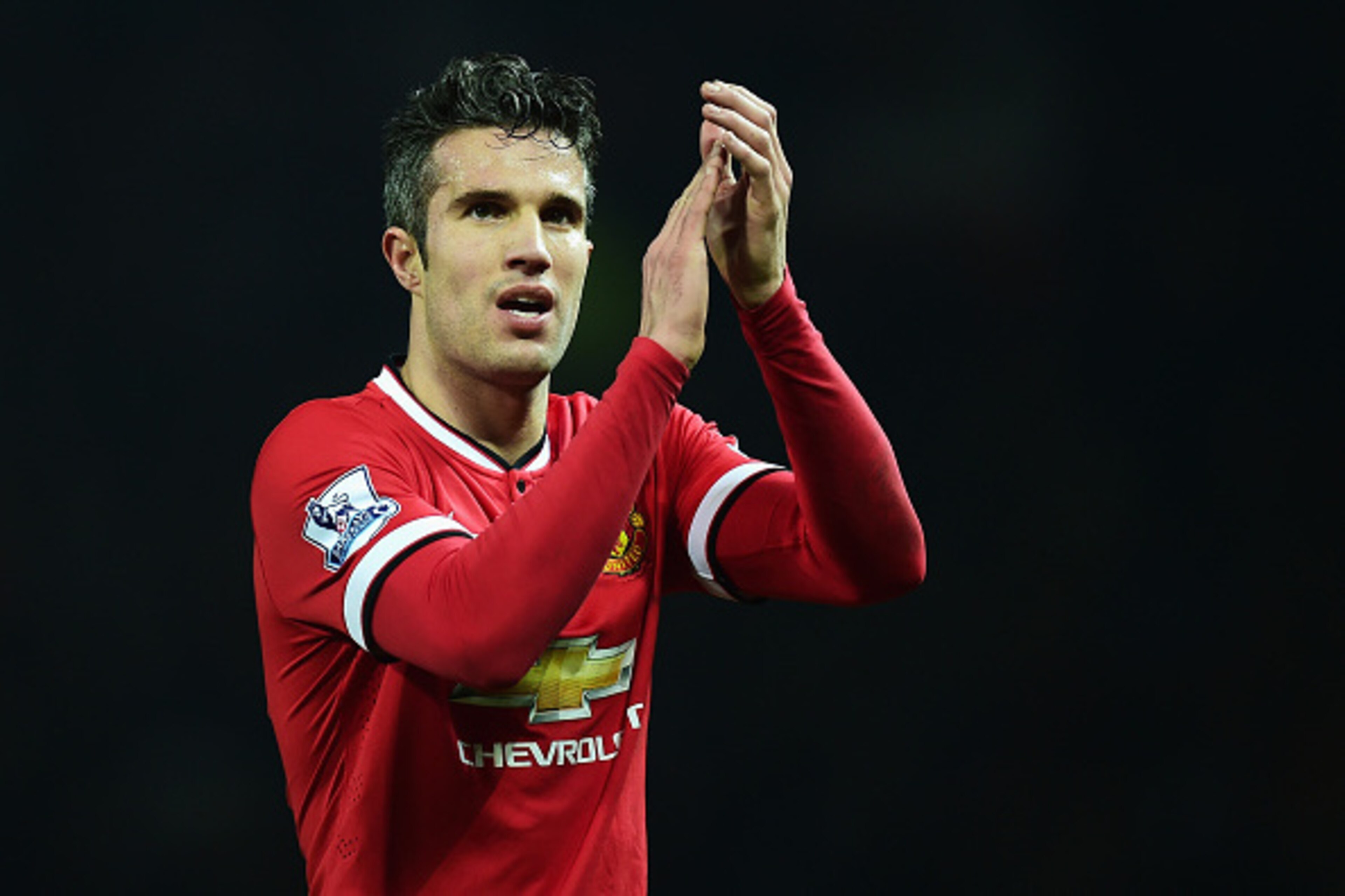 MANCHESTER, ENGLAND - FEBRUARY 11: Robin van Persie of Manchester United celebrates victory after the Barclays Premier League match between Manchester United and Burnley at Old Trafford on February 11, 2015 in Manchester, England.  (Photo by Jamie McDonal
