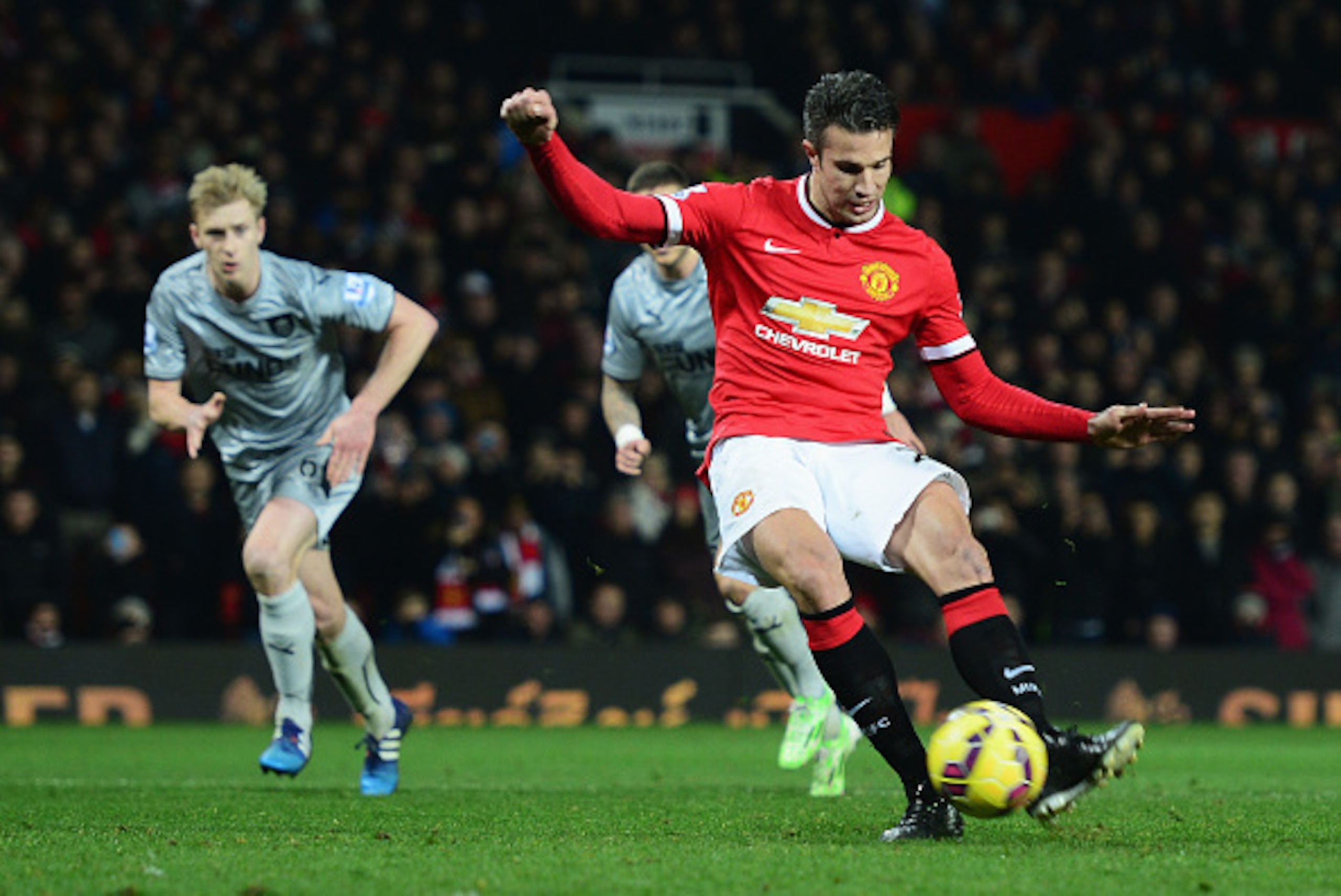 MANCHESTER, ENGLAND - FEBRUARY 11:  Robin van Persie of Manchester United scores from the penalty spot during the Barclays Premier League match between Manchester United and Burnley at Old Trafford on February 11, 2015 in Manchester, England.  (Photo by J