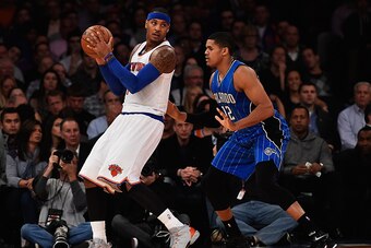 NEW YORK, NY - NOVEMBER 12:  Carmelo Anthony #7 of the New York Knicks dribbles against Tobias Harris #12 of the Orlando Magic during their game at Madison Square Garden on November 12, 2014 in New York City.  (Photo by Al Bello/Getty Images)