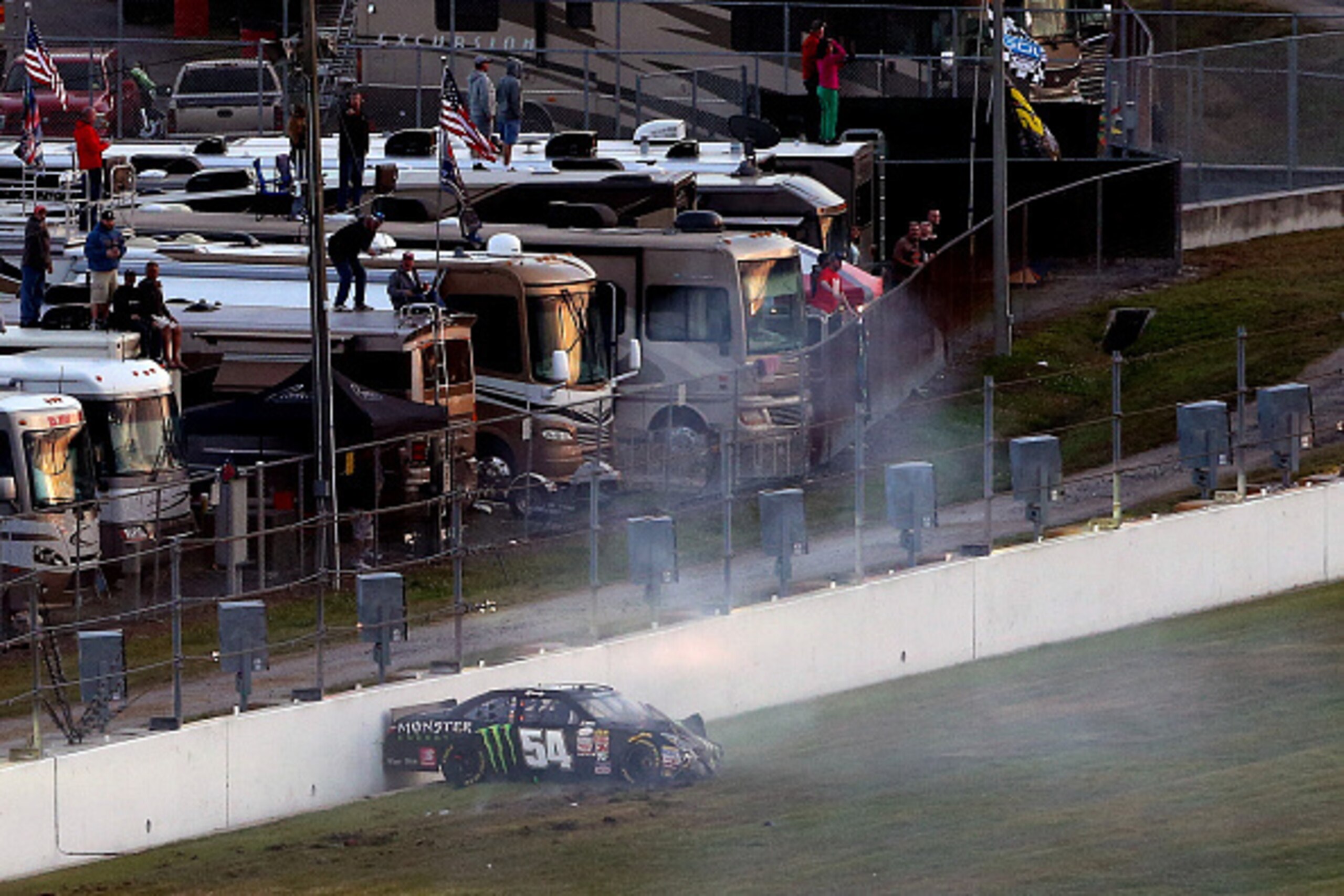 DAYTONA BEACH, FL - FEBRUARY 21:  Kyle Busch, driver of the #54 Monster energy Toyota, is seen stopped against a wall after crashing during the NASCAR XFINITY Series Alert Today Florida 300 at Daytona International Speedway on February 21, 2015 in Daytona