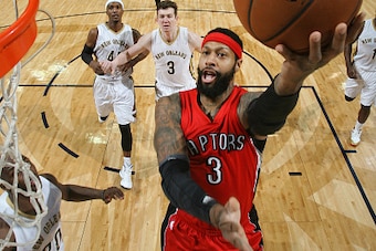 NEW ORLEANS, LA - FEBRUARY 23: James Johnson #3 of the Toronto Raptors goes for the lay up against the New Orleans Pelicans during the game on February 23, 2015 at Smoothie King Center in New Orleans, Louisiana. NOTE TO USER: User expressly acknowledges a