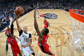 NEW ORLEANS, LA - FEBRUARY 23: Eric Gordon #10 of the New Orleans Pelicans goes for the lay up against the Toronto Raptors during the game on February 23, 2015 at Smoothie King Center in New Orleans, Louisiana. NOTE TO USER: User expressly acknowledges an