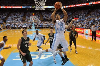 CHAPEL HILL, NC - DECEMBER 30: J.P. Tokoto #13 of the North Carolina Tar Heels goes to the basket against the William & Mary Tribe during their game at the Dean Smith Center on December 30, 2014 in Chapel Hill, North Carolina. North Carolina defeated Will