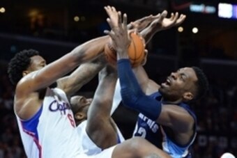 Feb 23, 2015; Los Angeles, CA, USA; Los Angeles Clippers center DeAndre Jordan (6) blocks a shot by Memphis Grizzlies guard Nick Calathes (12) in the second half of the game at Staples Center. Girzzlies won 90-87. Mandatory Credit: Jayne Kamin-Oncea-USA T