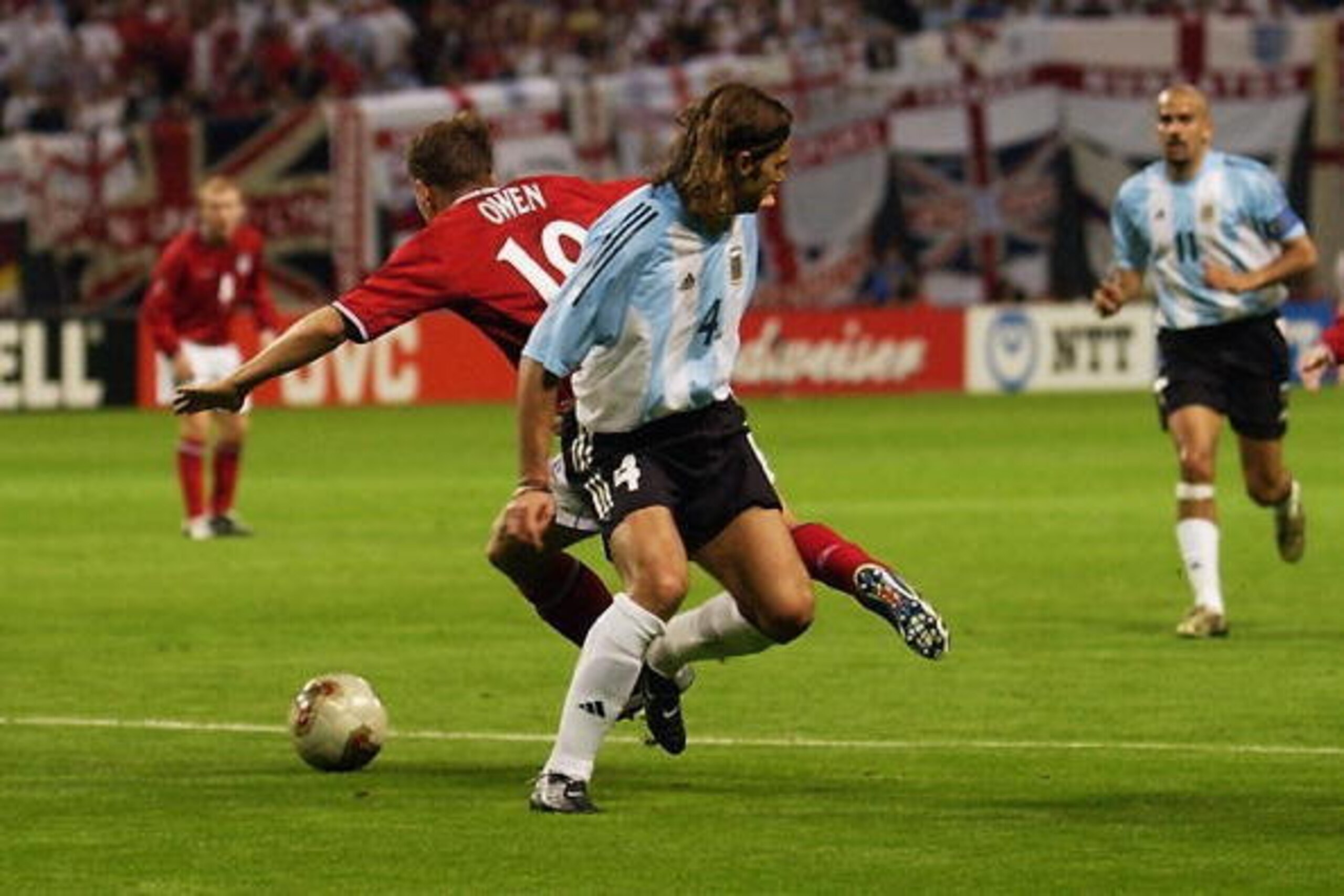 SAPPORO - JUNE 7: Michael Owen of England is fowled by Mauricio Pochettino of Argentina during the Group F match during the World Cup Group Stage played at the Sapporo Dome, Sapporo, Japan on June 7, 2002. England won the match 1-0. (Photo by Stu Forste SAPPORO - JUNE 7: Michael Owen of England is fowled by Mauricio Pochettino of Argentina during the Group F match during the World Cup Group Stage played at the Sapporo Dome, Sapporo, Japan on June 7, 2002. England won the match 1-0. (Photo by Stu Forste