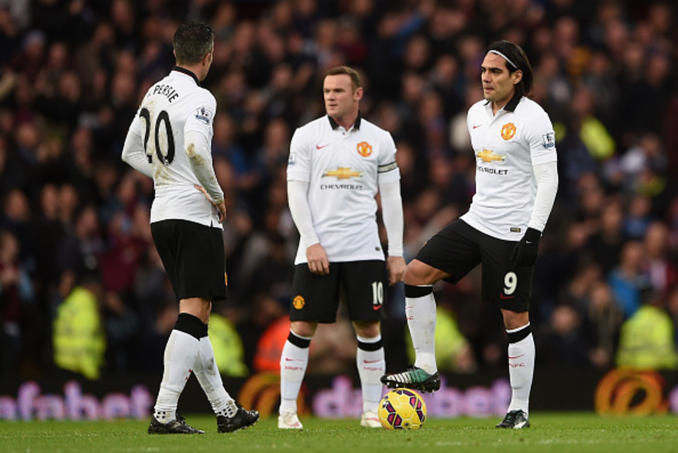 BIRMINGHAM, ENGLAND - DECEMBER 20:  A dejected Robin van Persie, Wayne Rooney and Radamel Falcao García of Manchester United prepare to restart after conceding the first goal during the Barclays Premier League match between Aston Villa and Manchester Unit