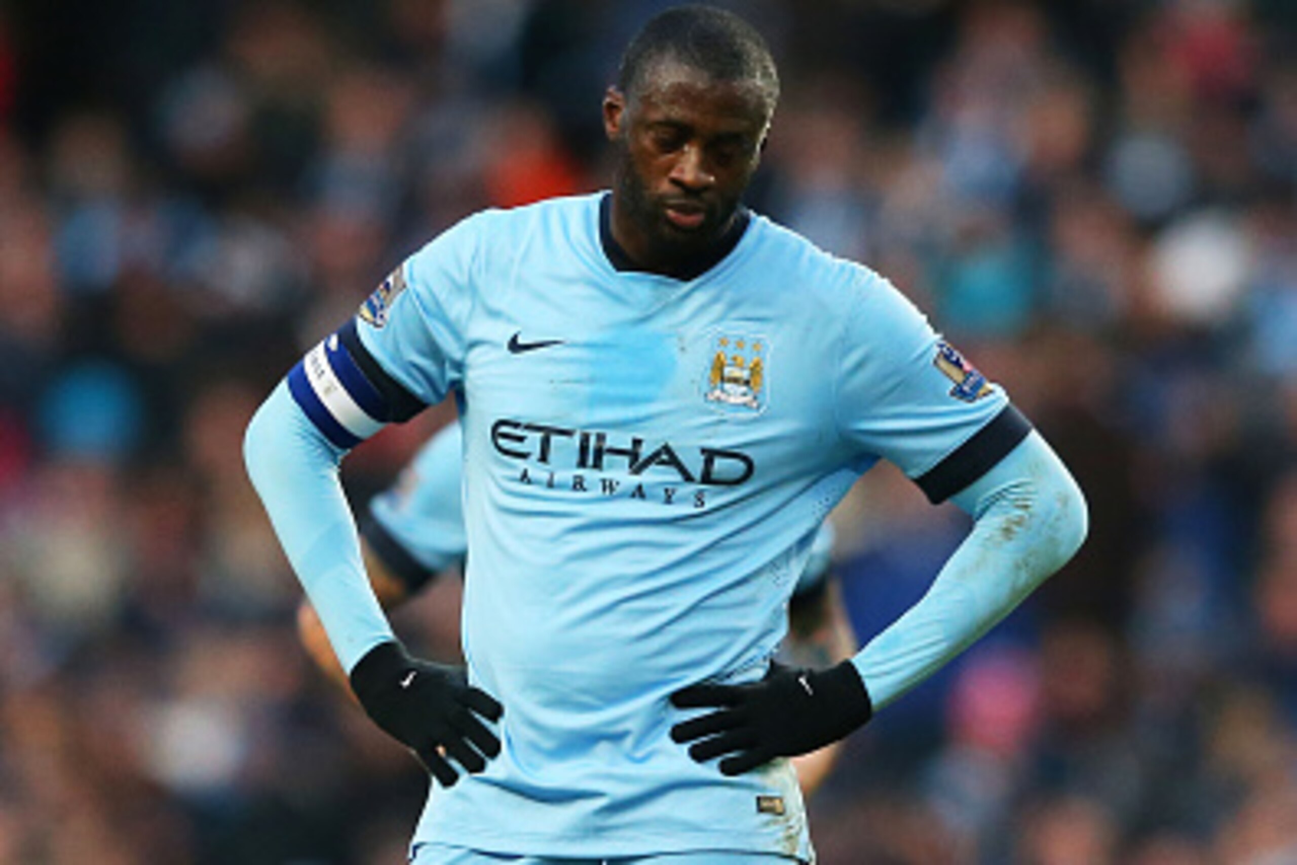 MANCHESTER, ENGLAND - JANUARY 04:  A dejected Yaya Toure of Manchester City reacts during the FA Cup Third Round match between  Manchester City and Sheffield Wednesday at Etihad Stadium on January 4, 2015 in Manchester, England.  (Photo by Alex Livesey/Ge