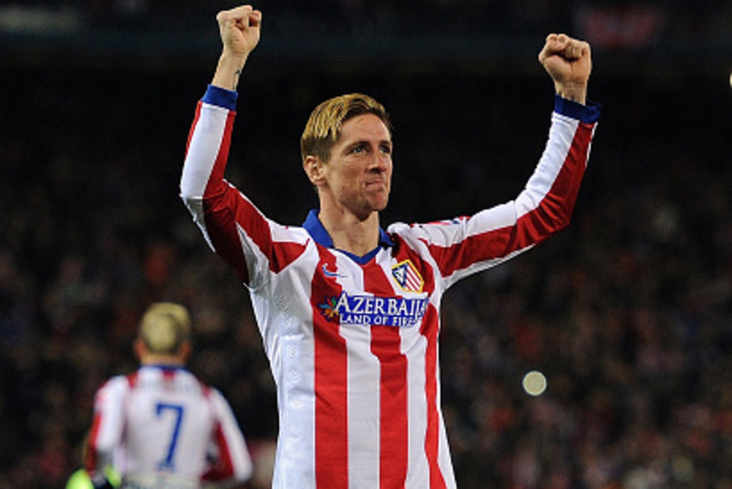MADRID, SPAIN - JANUARY 28:  Fernando Torres of Club Atletico de Madrid celebrates after scoring his team's opening goal during the Copa del Rey Quarter Final Second Leg match between Club Atletico de Madrid and FC Barcelona at Vicente Calderon Stadium on