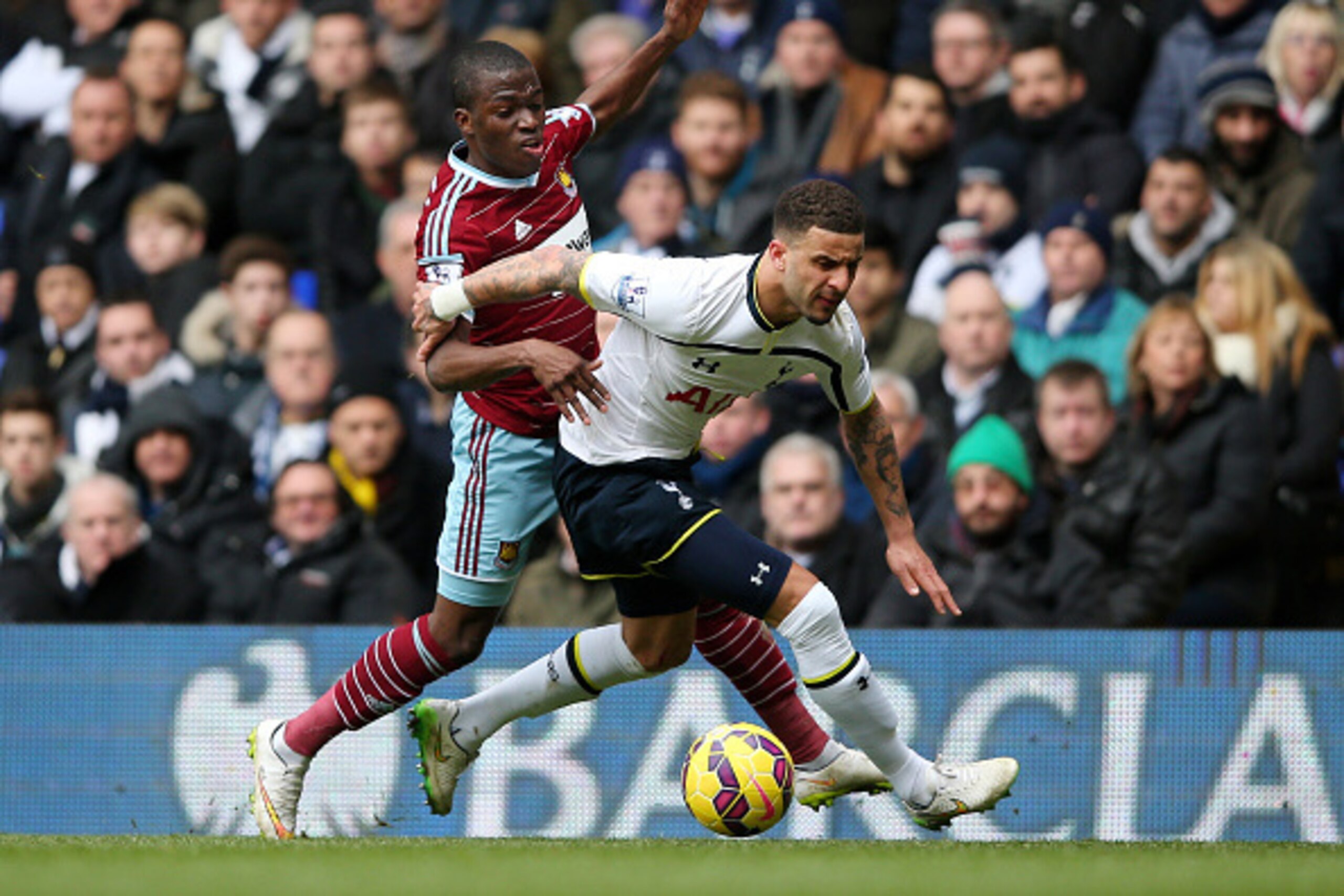 LONDON, ENGLAND - FEBRUARY 22:  Kyle Walker of Spurs shields the ball from Enner Valencia of West Ham during the Barclays Premier League match between Tottenham Hotspur and West Ham United at White Hart Lane on February 22, 2015 in London, England.  (Phot
