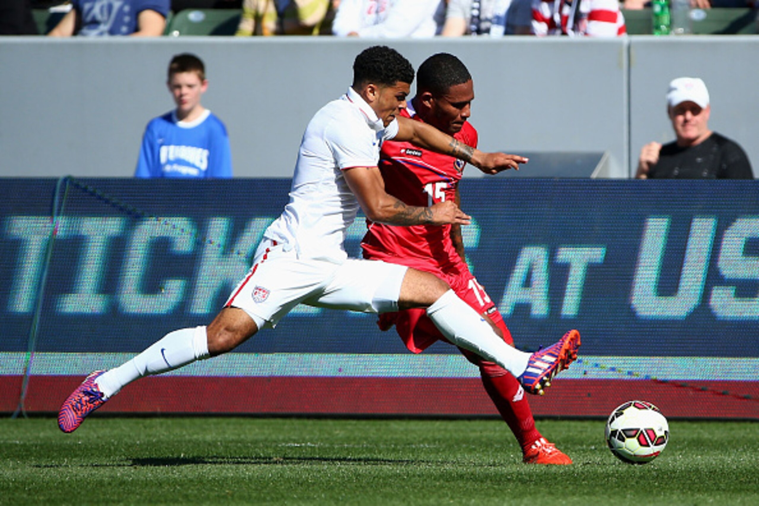LOS ANGELES, CA - FEBRUARY 08:  Eric Davis #15 of Panama tries to play the ball wide against DeAndre Yedlin #2 of the USA in the first half of their international men's friendly match at StubHub Center on February 8, 2015 in Los Angeles, California. The U