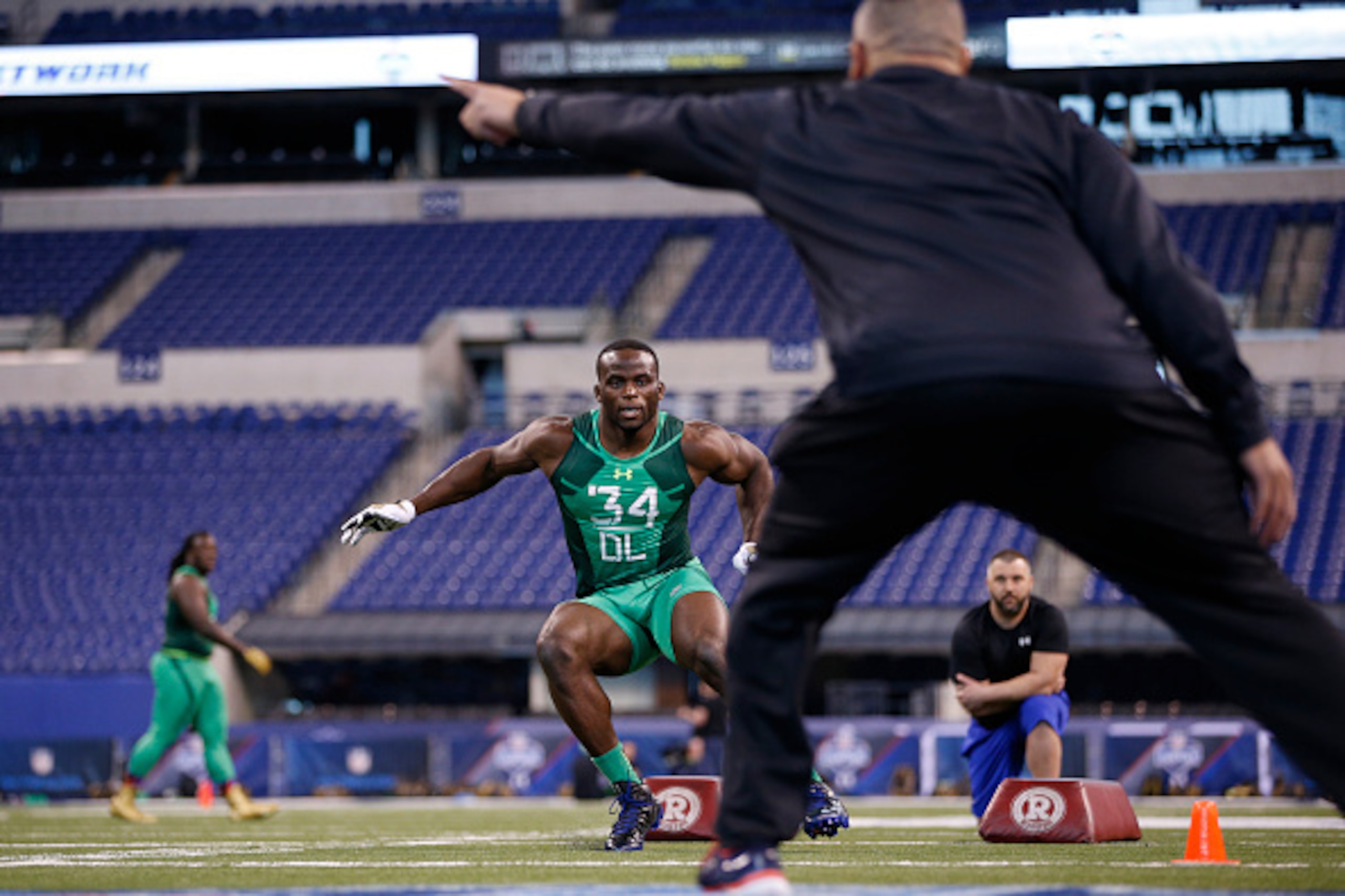 INDIANAPOLIS, IN - FEBRUARY 22: Defensive lineman Owamagbe Odighizuwa of UCLA competes during the 2015 NFL Scouting Combine at Lucas Oil Stadium on February 22, 2015 in Indianapolis, Indiana. (Photo by Joe Robbins/Getty Images)