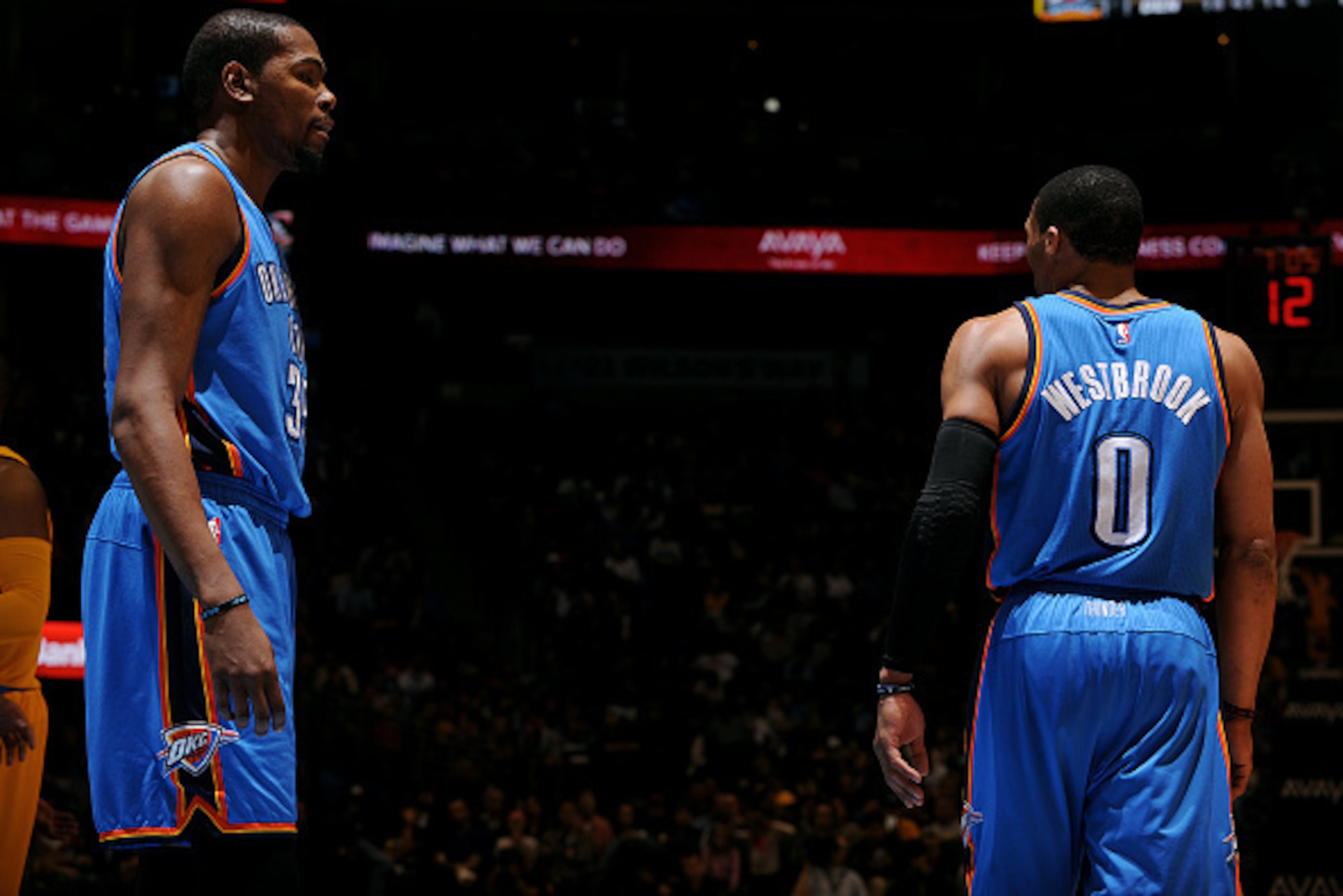 DENVER, CO - FEBRUARY 9: Kevin Durant #35 and Russell Westbrook #0 of the Oklahoma City Thunder stand on the court during a game against the Denver Nuggets on February 9, 2015 at the Pepsi Center in Denver, Colorado. NOTE TO USER: User expressly acknowled