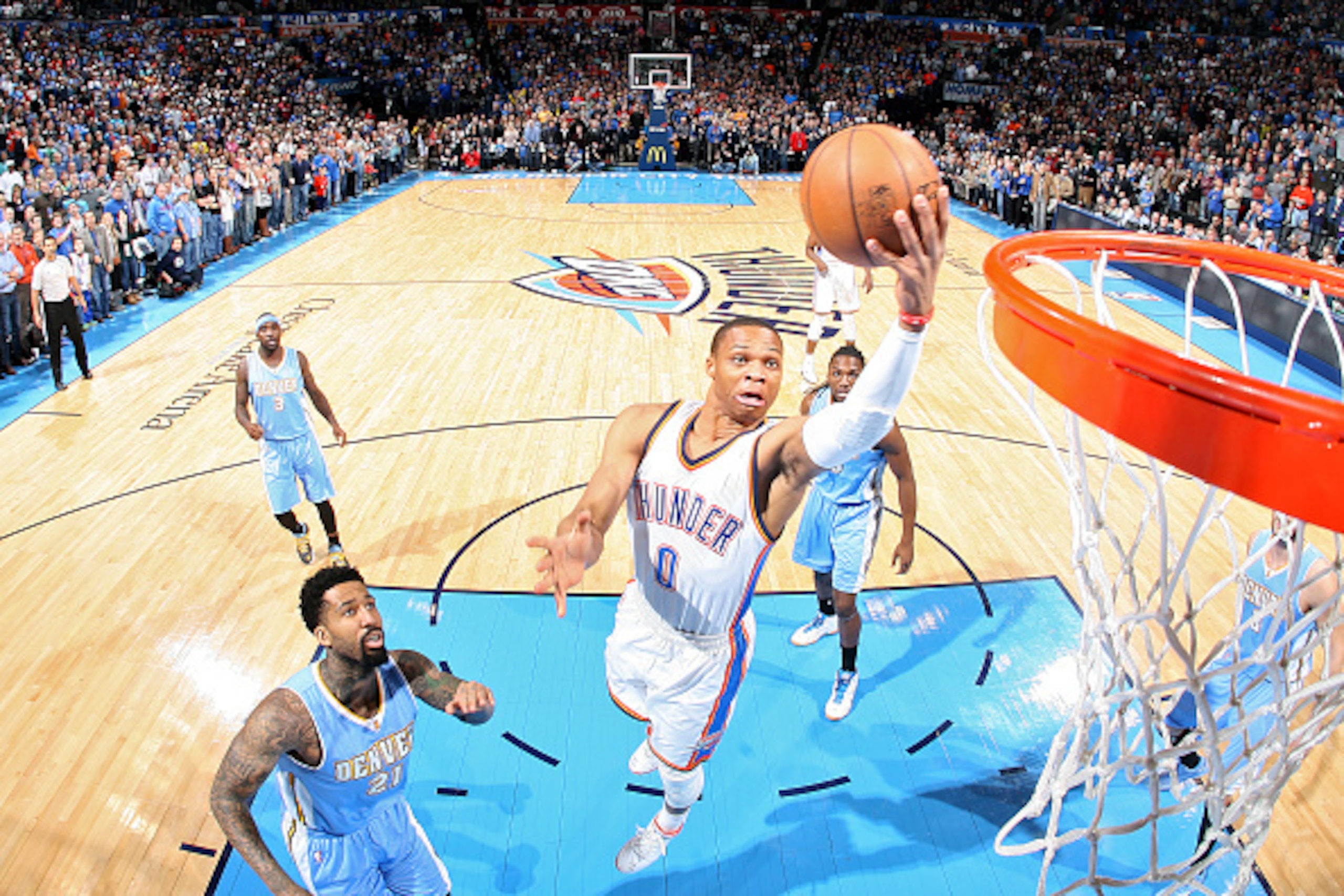 OKLAHOMA CITY, OK - FEBRUARY 22:  Russell Westbrook #0 of the Oklahoma City Thunder goes to the basket against the Denver Nuggets on February 22, 2015 at the Chesapeake Energy Arena in Oklahoma City, Oklahoma. NOTE TO USER: User expressly acknowledges and