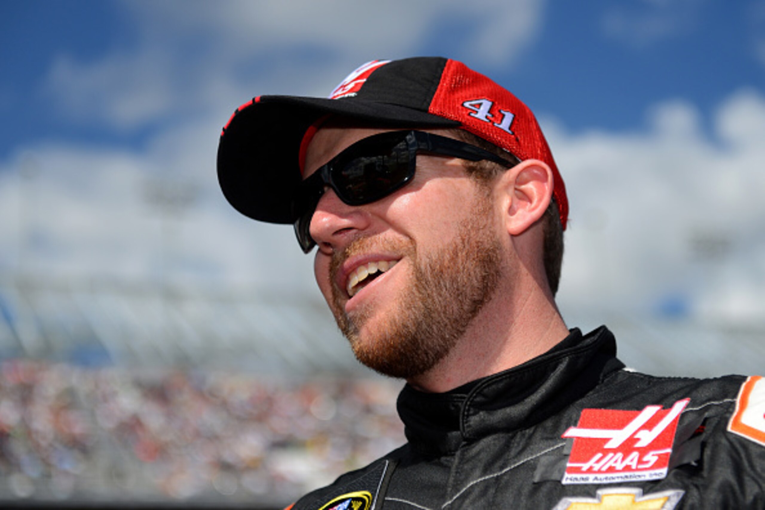 DAYTONA BEACH, FL - FEBRUARY 22:  Regan Smith, driver of the #41 Haas Automation Chevrolet, looks on from the grid prior to the NASCAR Sprint Cup Series 57th Annual Daytona 500 at Daytona International Speedway on February 22, 2015 in Daytona Beach, Flori