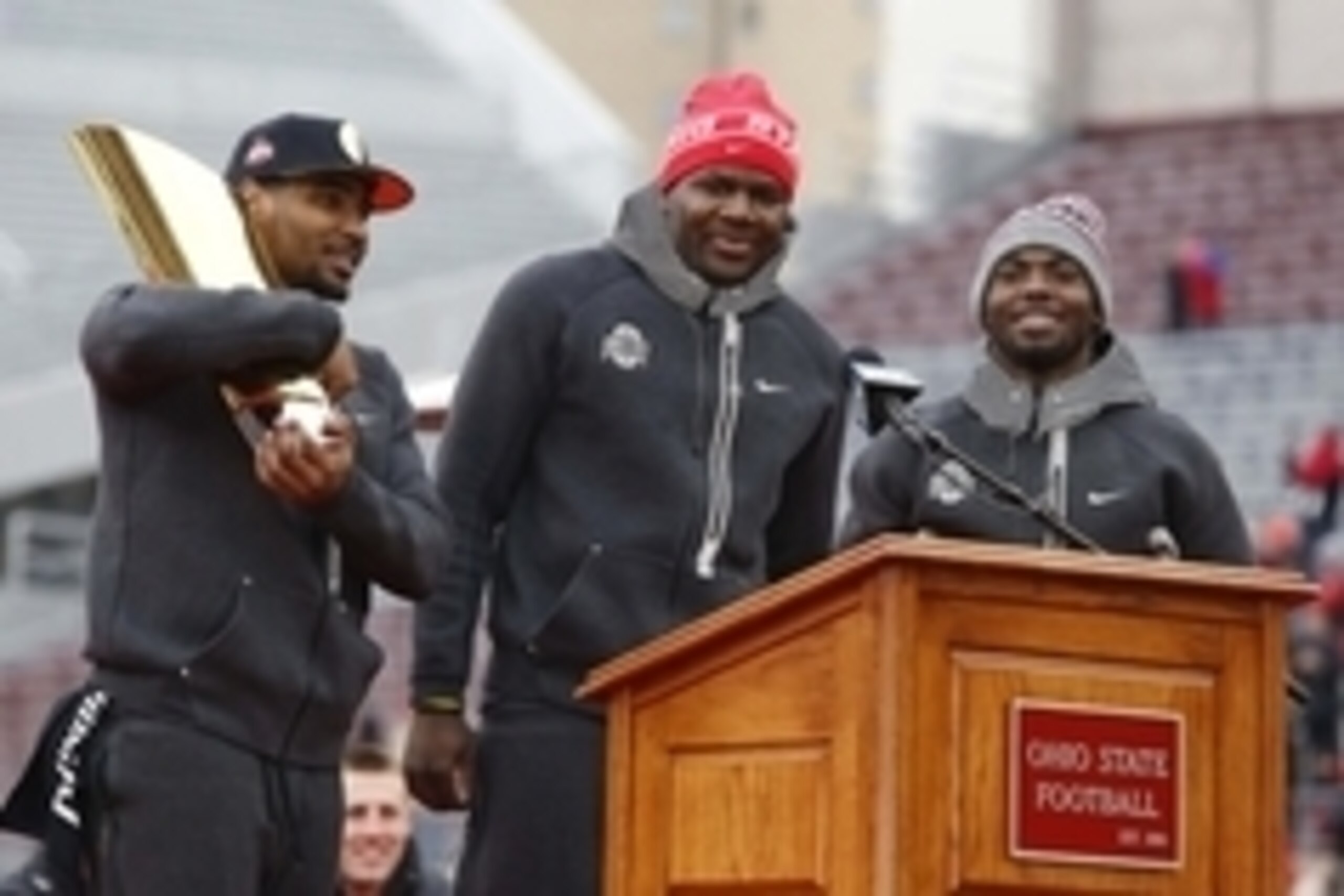 Jan 24, 2015; Columbus, OH, USA; Ohio State Buckeyes quarterback Braxton Miller (left) and quarterback Cardale Jones (center) and Buckeyes quarterback J.T. Barrett (right) at the national championship celebration at Ohio Stadium. Mandatory Credit: Joe Mai
