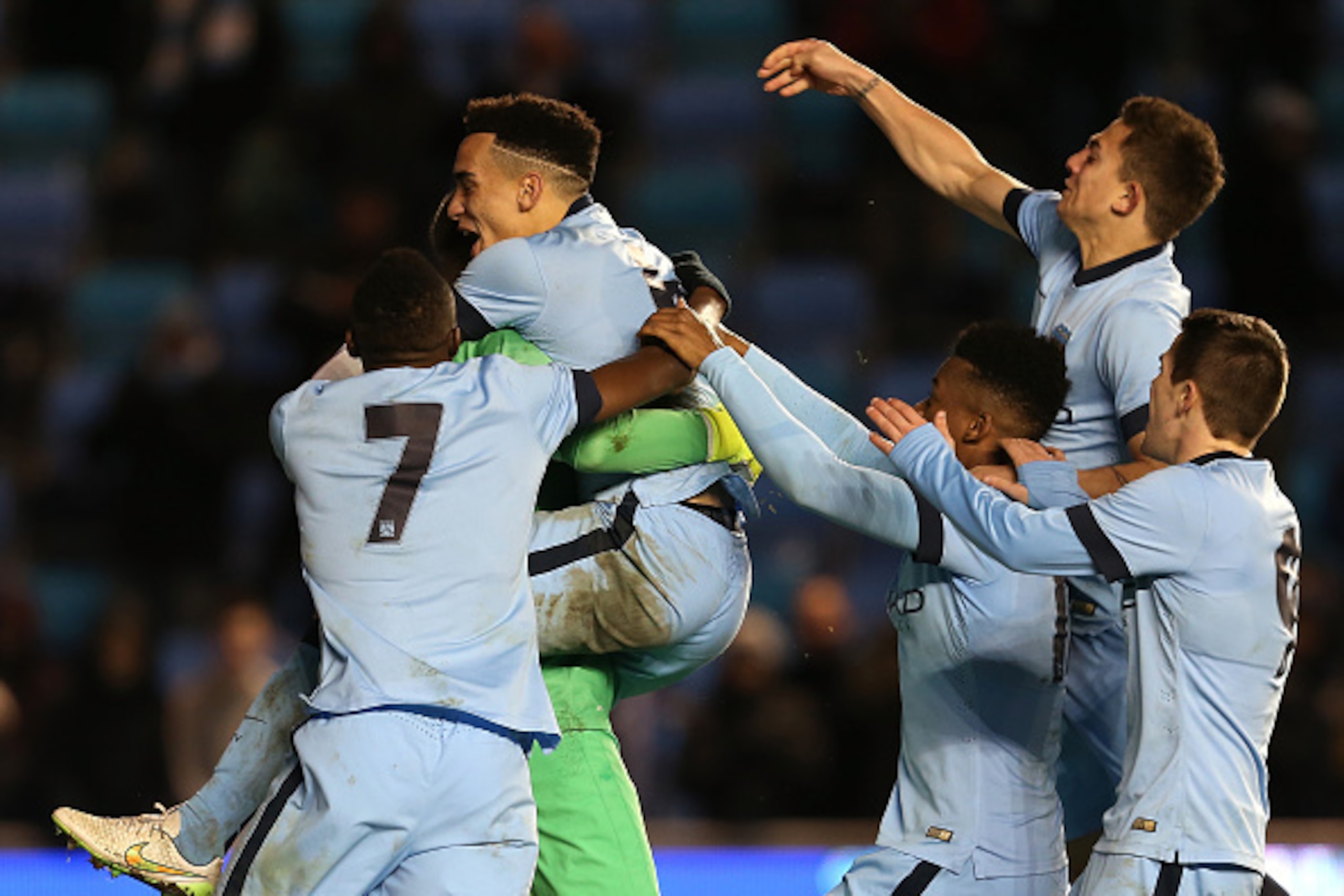 MANCHESTER, ENGLAND - FEBRUARY 24:  Kean Bryan and Angus Gunn, Goalkeeper of Manchester City celebrate winning on a penalty shoot out during the UEFA Youth League Round of 16 match between Manchester City FC and FC Schalke 04 at City Football Academy on F
