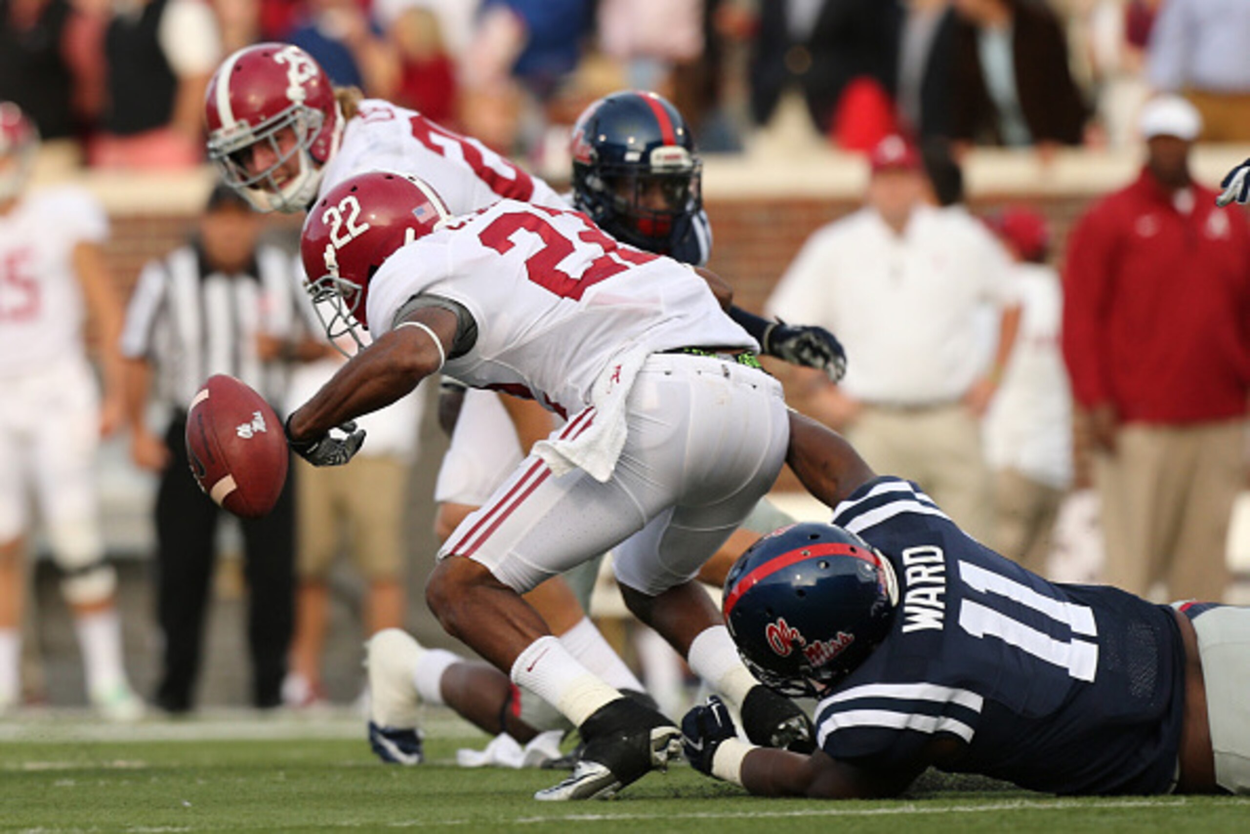 OXFORD, MS - OCTOBER 4: Channing Ward #11 of the Ole Miss Rebels strips the ball for a fumble against Christion Jones #22 of the Alabama Crimson Tide on OCTOBER 4, 2014 at Vaught-Hemingway Stadium in Oxford, Mississippi. Mississippi beat Alabama 23-17. (P