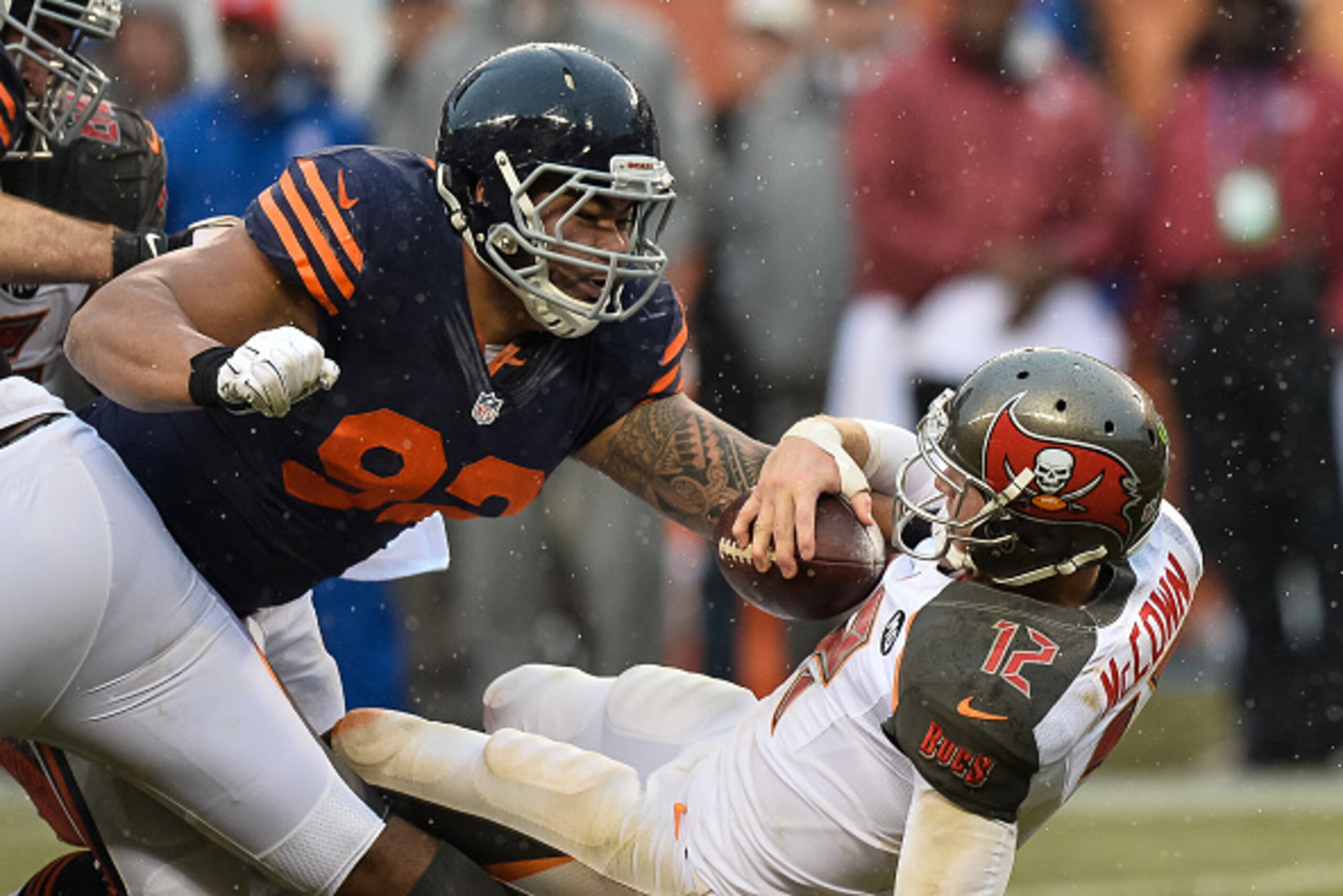CHICAGO, IL - NOVEMBER 23:  Quarterback Josh McCown #12 of the Tampa Bay Buccaneers is sacked by defensive tackle Stephen Paea #92 of the Chicago Bears in the third quarter at Soldier Field on November 23, 2014 in Chicago, Illinois.  (Photo by Brian Kerse
