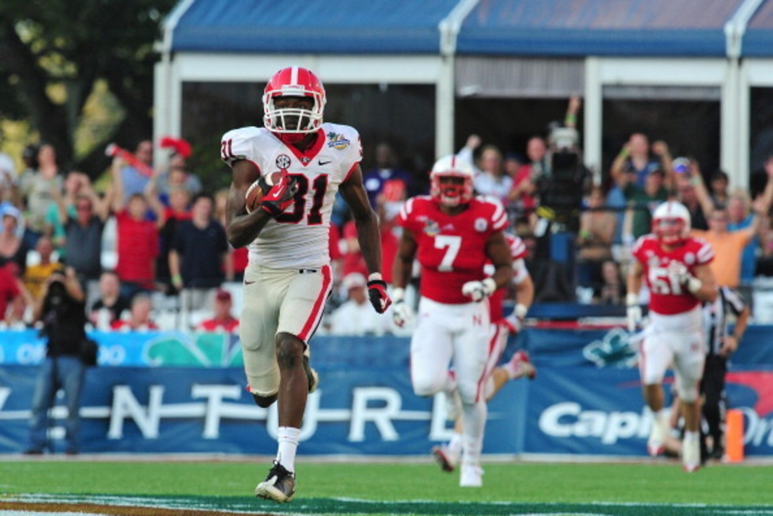 ORLANDO, FL - JANUARY 1: Chris Conley #31 of the Georgia Bulldogs scores on an 87 yard reception against the Nebraska Cornhuskers during the Capital One Bowl at the Citrus Bowl on January 1, 2013 in Orlando, Florida. (Photo by Scott Cunningham/Getty Image