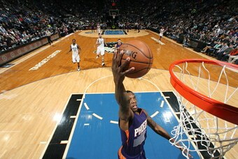 MINNEAPOLIS, MN -  FEBRUARY 20:  Eric Bledsoe #2 of the Phoenix Suns goes up for a dunk against the Minnesota Timberwolves during the game on February 20, 2015 at Target Center in Minneapolis, Minnesota. NOTE TO USER: User expressly acknowledges and agree