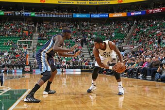 SALT LAKE CITY, UT - FEBRUARY 4:  Derrick Favors #15 of the Utah Jazz handles the ball against Zach Randolph #50 of the Memphis Grizzlies during the game on February 4, 2015 at EnergySolutions Arena in Salt Lake City, Utah. NOTE TO USER: User expressly ac