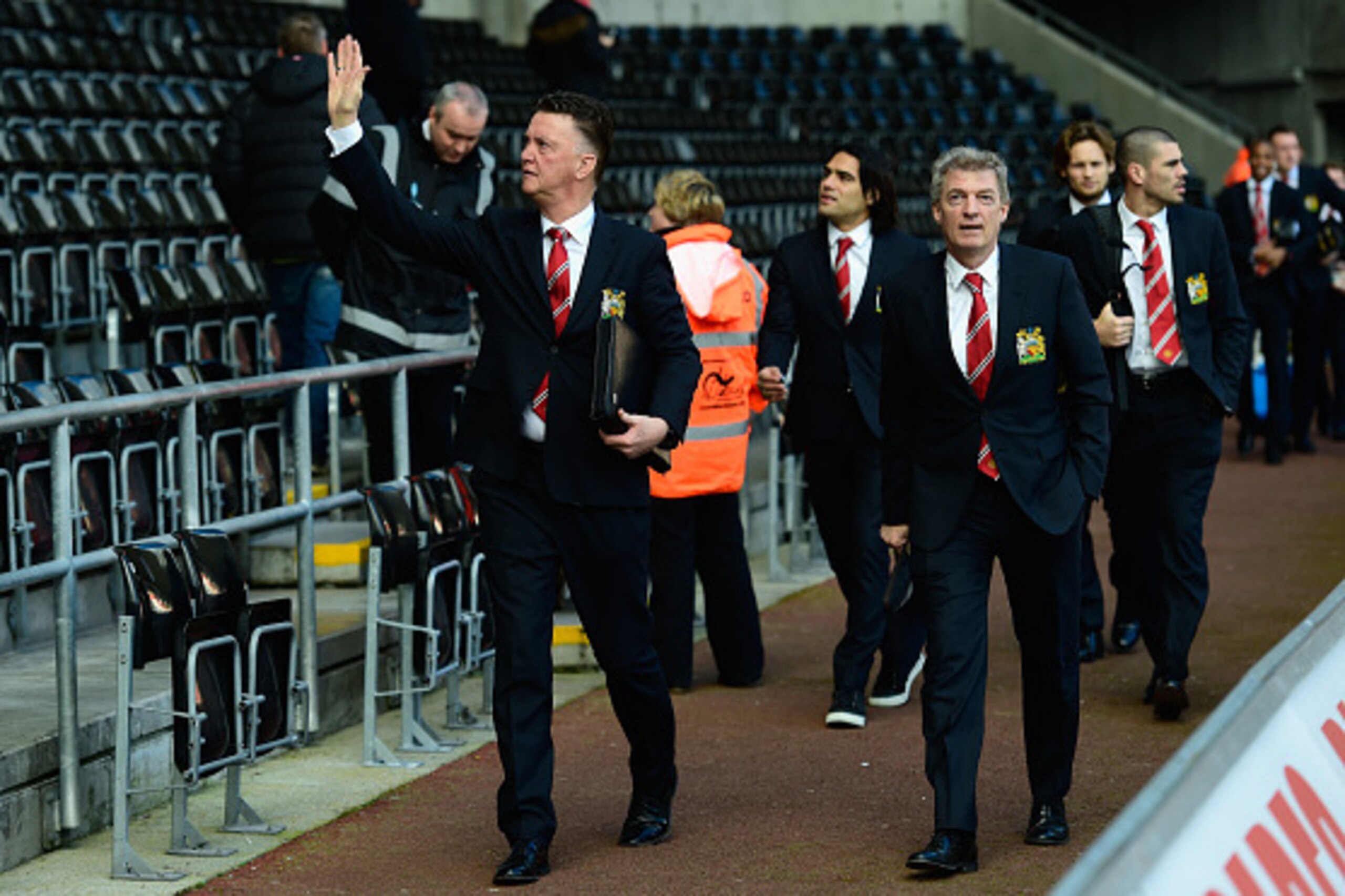 SWANSEA, WALES - FEBRUARY 21:  Manchester United manager Louis Van Gaal (l) waves to the fans before the Barclays Premier League match between Swansea City and Manchester United at Liberty Stadium on February 21, 2015 in Swansea, Wales.  (Photo by Stu For