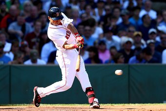 BOSTON, MA - SEPTEMBER 28: Mookie Betts #50 of the Boston Red Sox hits a single in the first inning against the New York Yankees during the last game of the season at Fenway Park on September 28, 2014 in Boston, Massachusetts.  (Photo by Elsa/Getty Images