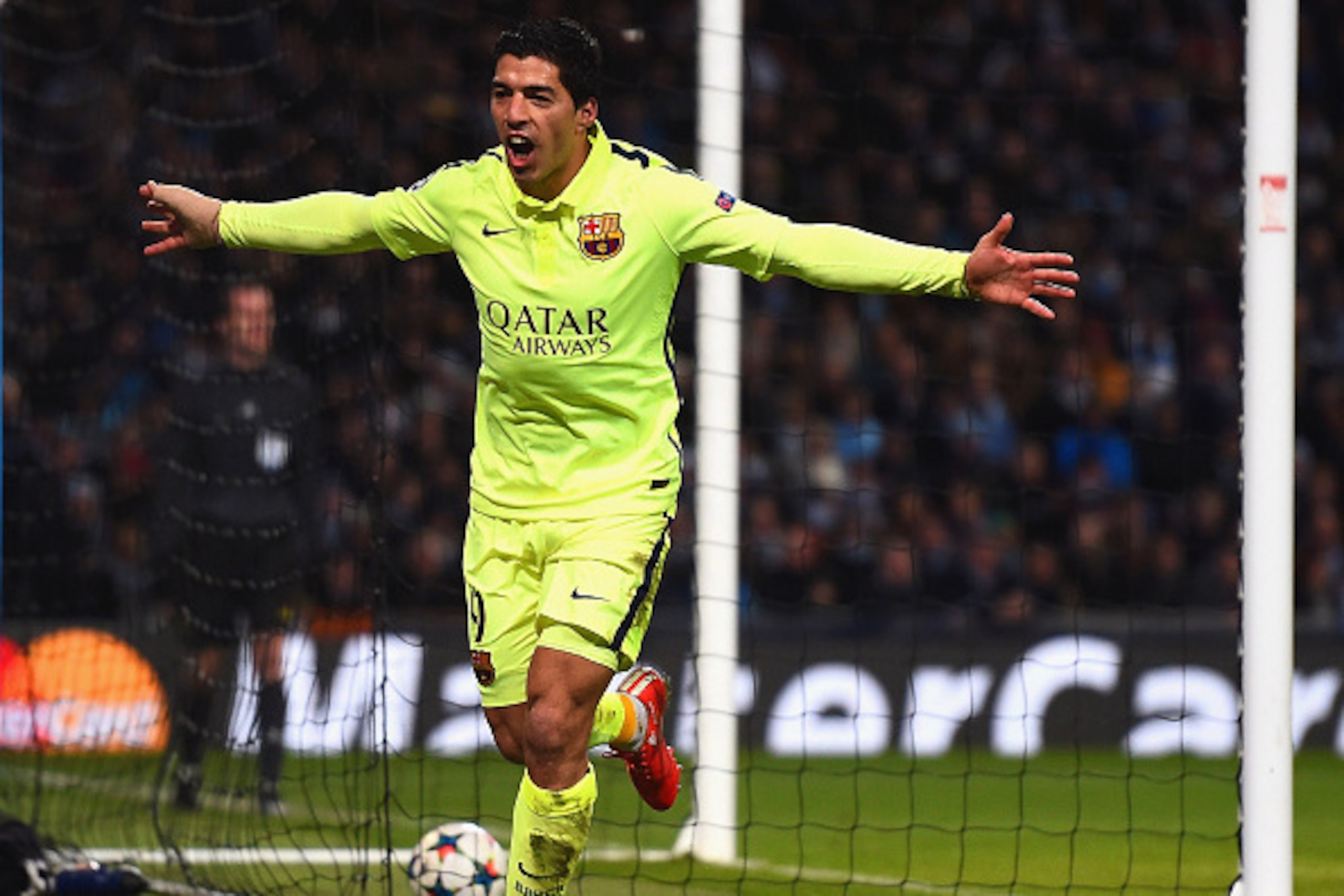 MANCHESTER, ENGLAND - FEBRUARY 24:  Luis Suarez of Barcelona celebrates scoring their second goal during the UEFA Champions League Round of 16 match between Manchester City and Barcelona at Etihad Stadium on February 24, 2015 in Manchester, United Kingdom