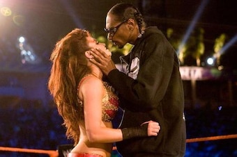 Snoop Dogg kisses Maria at WrestleMania.