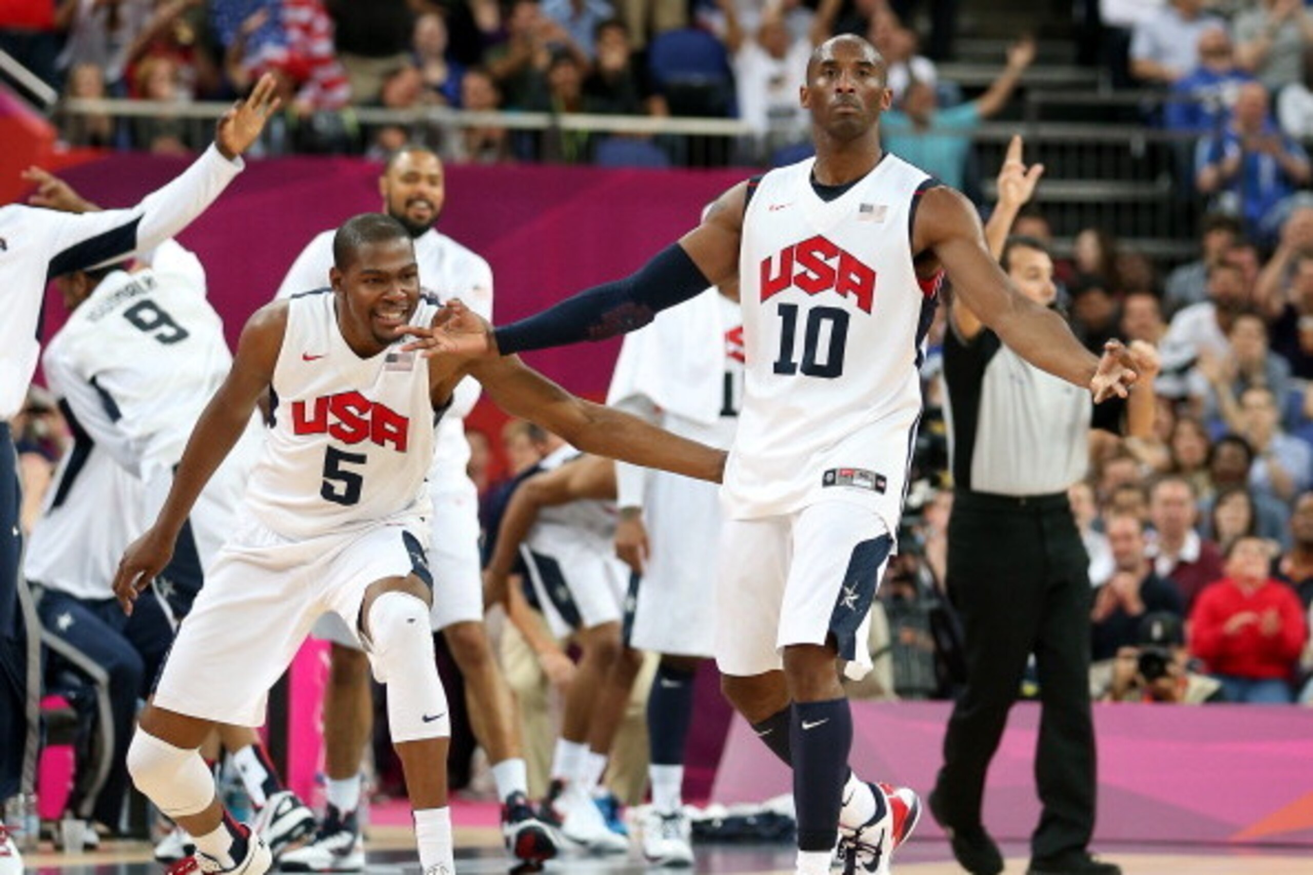 LONDON, ENGLAND - AUGUST 08:  Kobe Bryant #10 of United States reacts with teammate Kevin Durant #5 after Bryant makes a three-pointer in the second half against Australia during the Men's Basketball quaterfinal game on Day 12 of the London 2012 Olympic G