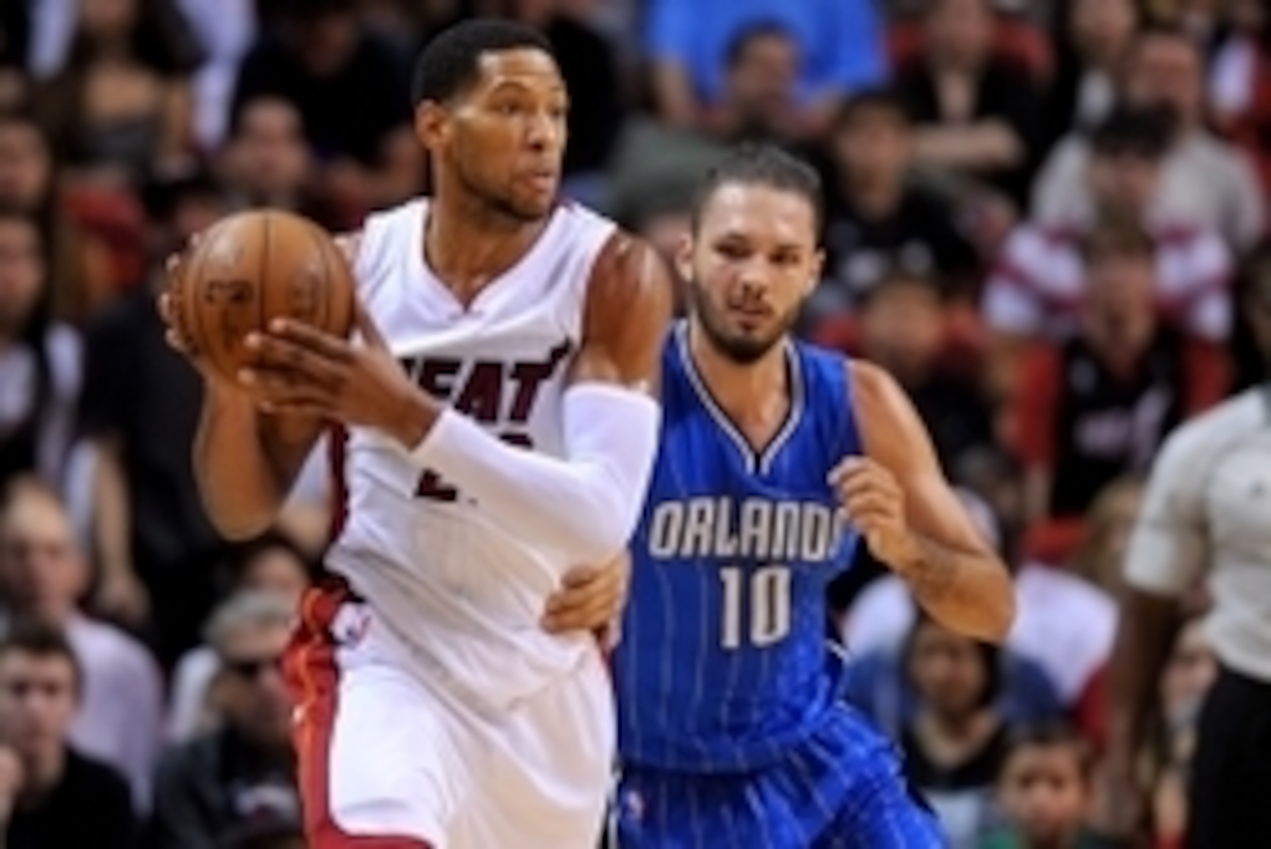 Dec 29, 2014; Miami, FL, USA; Miami Heat forward Danny Granger (22) is pressured by Orlando Magic guard Evan Fournier (10) during the first half at American Airlines Arena. Mandatory Credit: Steve Mitchell-USA TODAY Sports
