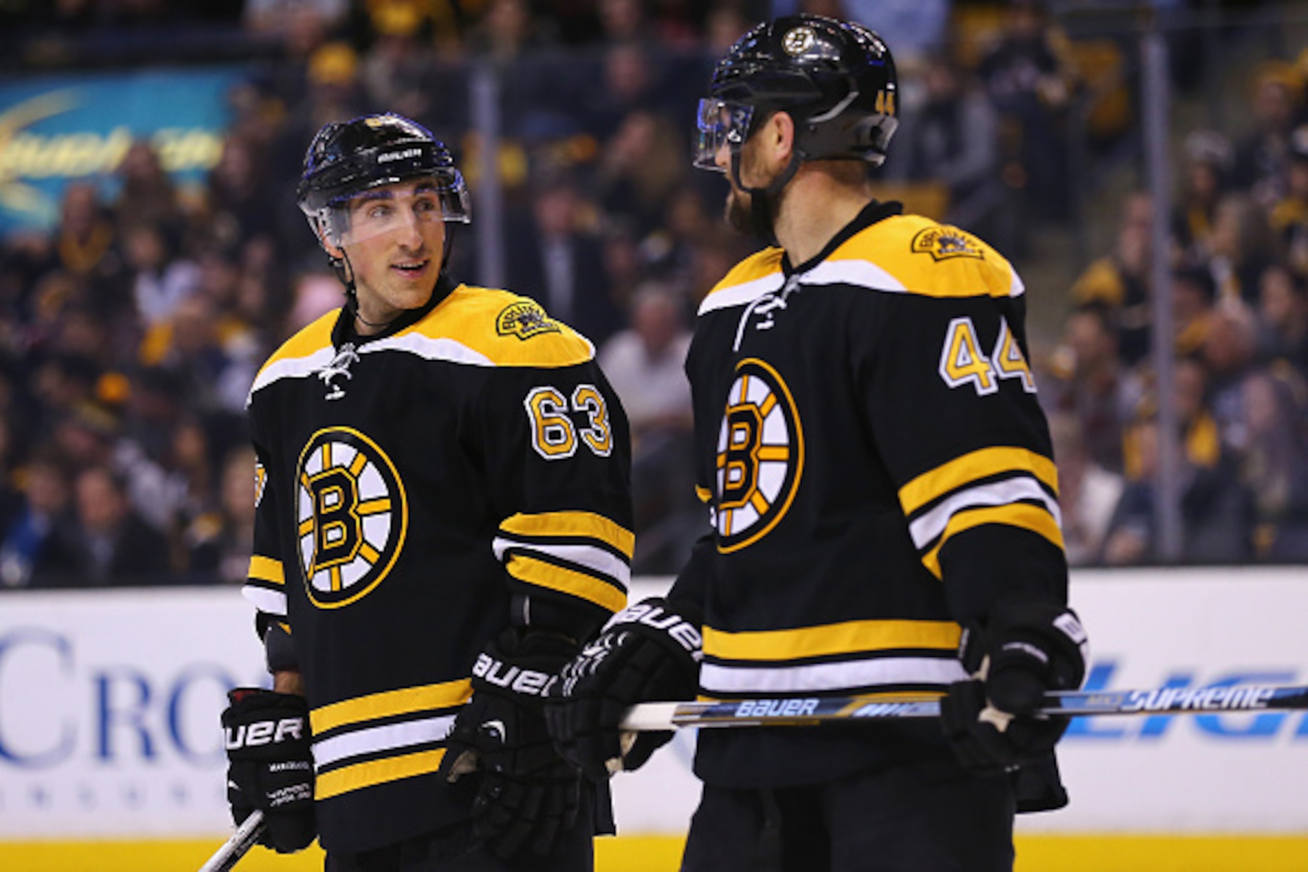 BOSTON, MA - FEBRUARY 24:  Brad Marchand #63 talks with Dennis Seidenberg #44 of the Boston Bruins in between plays during the second period against the Vancouver Canucks at TD Garden on February 24, 2015 in Boston, Massachusetts.  (Photo by Maddie Meyer/