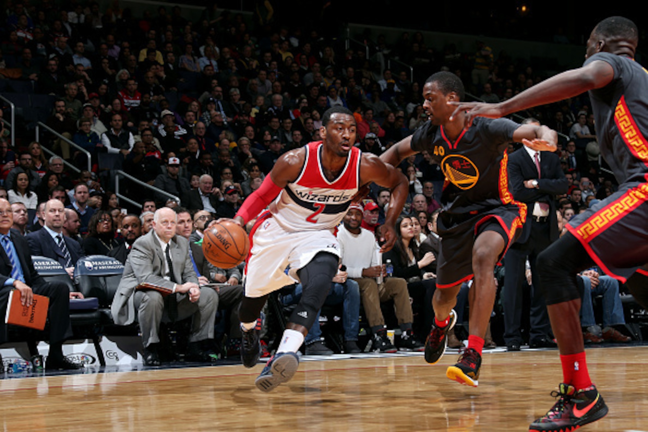 WASHINGTON, DC -  FEBRUARY 24: John Wall #2 of the Washington Wizards drives against the Golden State Warriors on February 24, 2015 at Verizon Center in Washington, DC. NOTE TO USER: User expressly acknowledges and agrees that, by downloading and or using