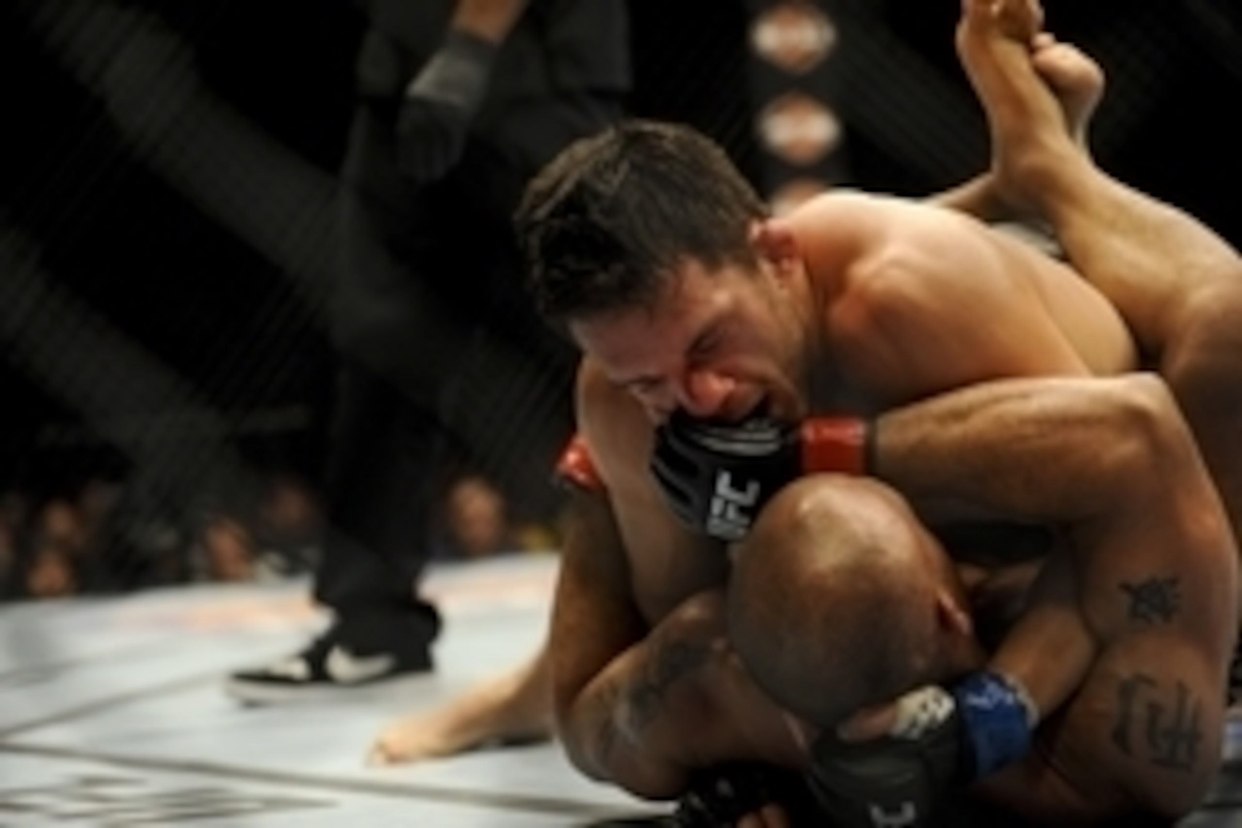 May 24, 2014; Las Vegas, NV, USA; Robbie Lawler (red) is pinned down by Jake Ellenberger (blue) during their UFC 173 light heavyweight bout at MGM Grand Garden Arena. Lawler won his bout by way of TKO. Mandatory Credit: Stephen R. Sylvanie-USA TODAY Sport May 24, 2014; Las Vegas, NV, USA; Robbie Lawler (red) is pinned down by Jake Ellenberger (blue) during their UFC 173 light heavyweight bout at MGM Grand Garden Arena. Lawler won his bout by way of TKO. Mandatory Credit: Stephen R. Sylvanie-USA TODAY Sport