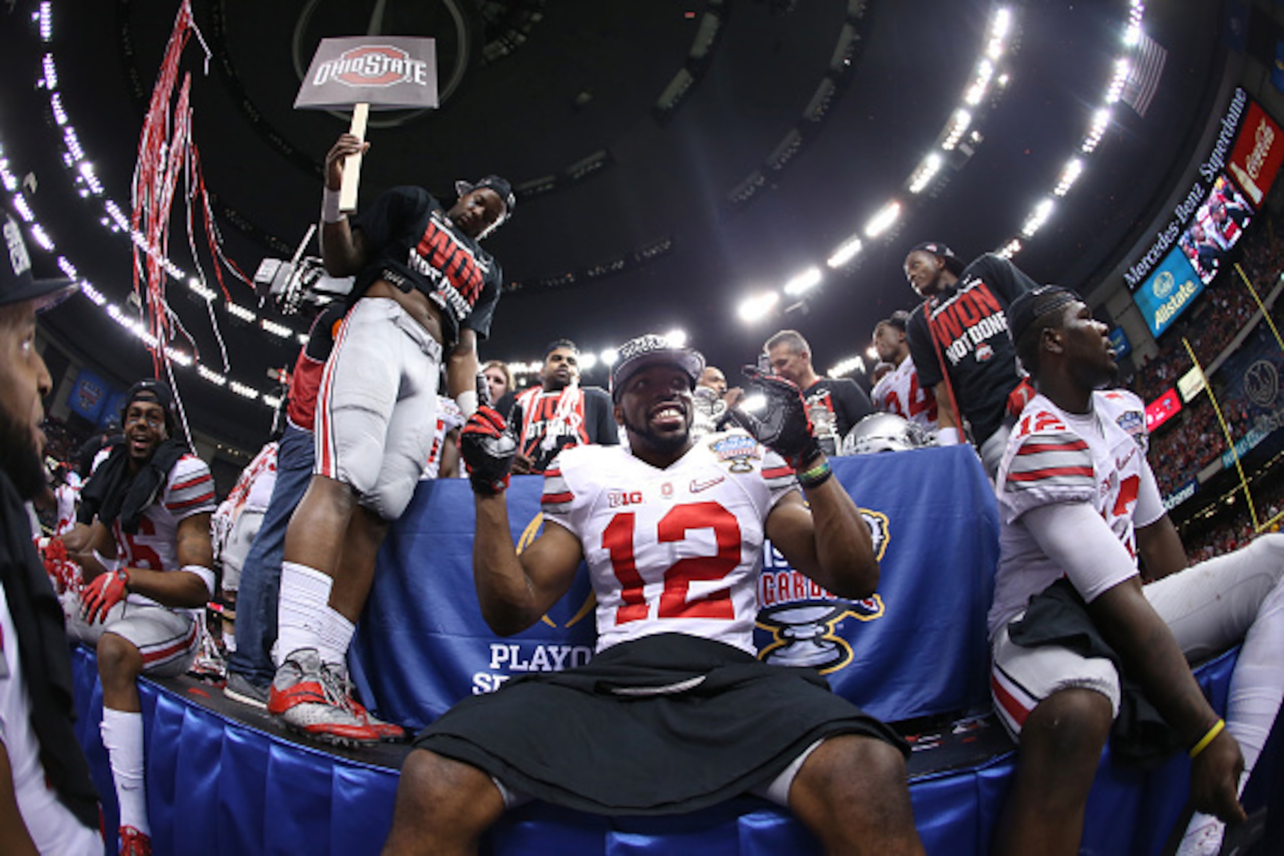 NEW ORLEANS, LA - JANUARY 01:  Cardale Jones #12 and Doran Grant #12 of the Ohio State Buckeyes celebrate after defeating the Alabama Crimson Tide 42-35 during the All State Sugar Bowl at the Mercedes-Benz Superdome on January 1, 2015 in New Orleans, Loui