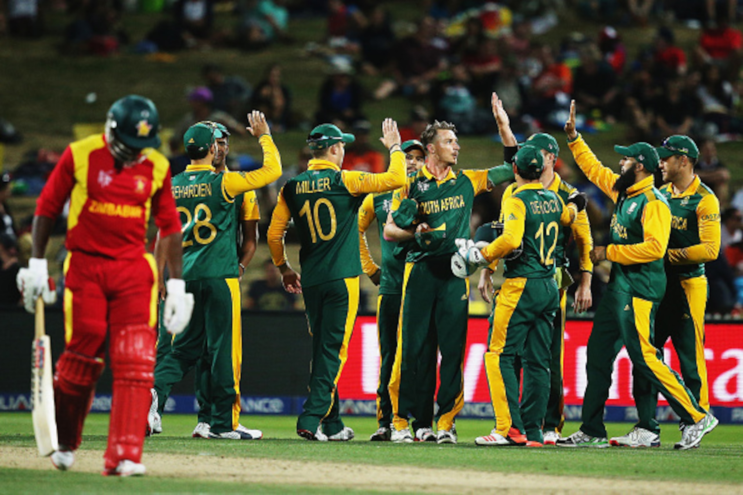 HAMILTON, NEW ZEALAND - FEBRUARY 15: Dale Steyn of South Africa celebrates the wicket of Craig Ervine of Zimbabwe during the 2015 ICC Cricket World Cup match between South Africa and Zimbabwe at Seddon Park on February 15, 2015 in Hamilton, New Zealand.  