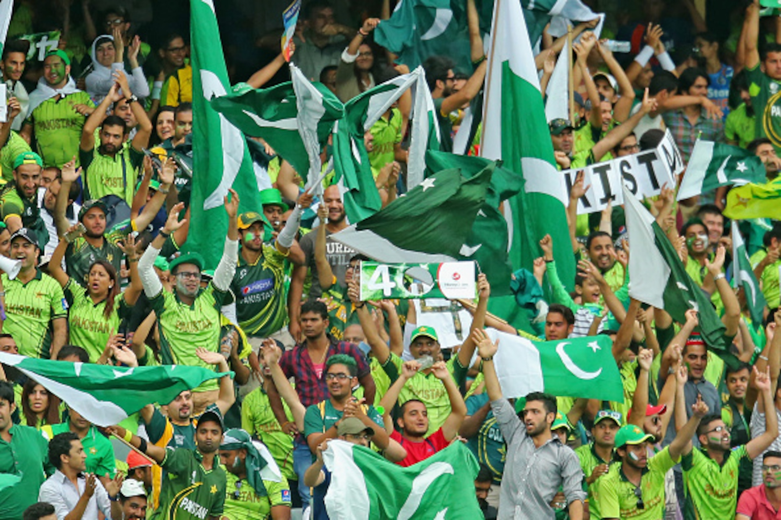 ADELAIDE, AUSTRALIA - FEBRUARY 15:  Pakistan supporters wave their flags as they celebrate a boundary during the 2015 ICC Cricket World Cup match between India and Pakistan at the Adelaide Oval on February 15, 2015 in Adelaide, Australia.  (Photo by Scott