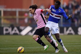 GENOA, ITALY - JANUARY 25: Edgar Barreto (L) of Palermo and Pedro Obiang of Sampdoria compete for the ball during the Serie A match between UC Sampdoria and US Citta di Palermo at Stadio Luigi Ferraris on January 25, 2015 in Genoa, Italy.  (Photo by Tulli