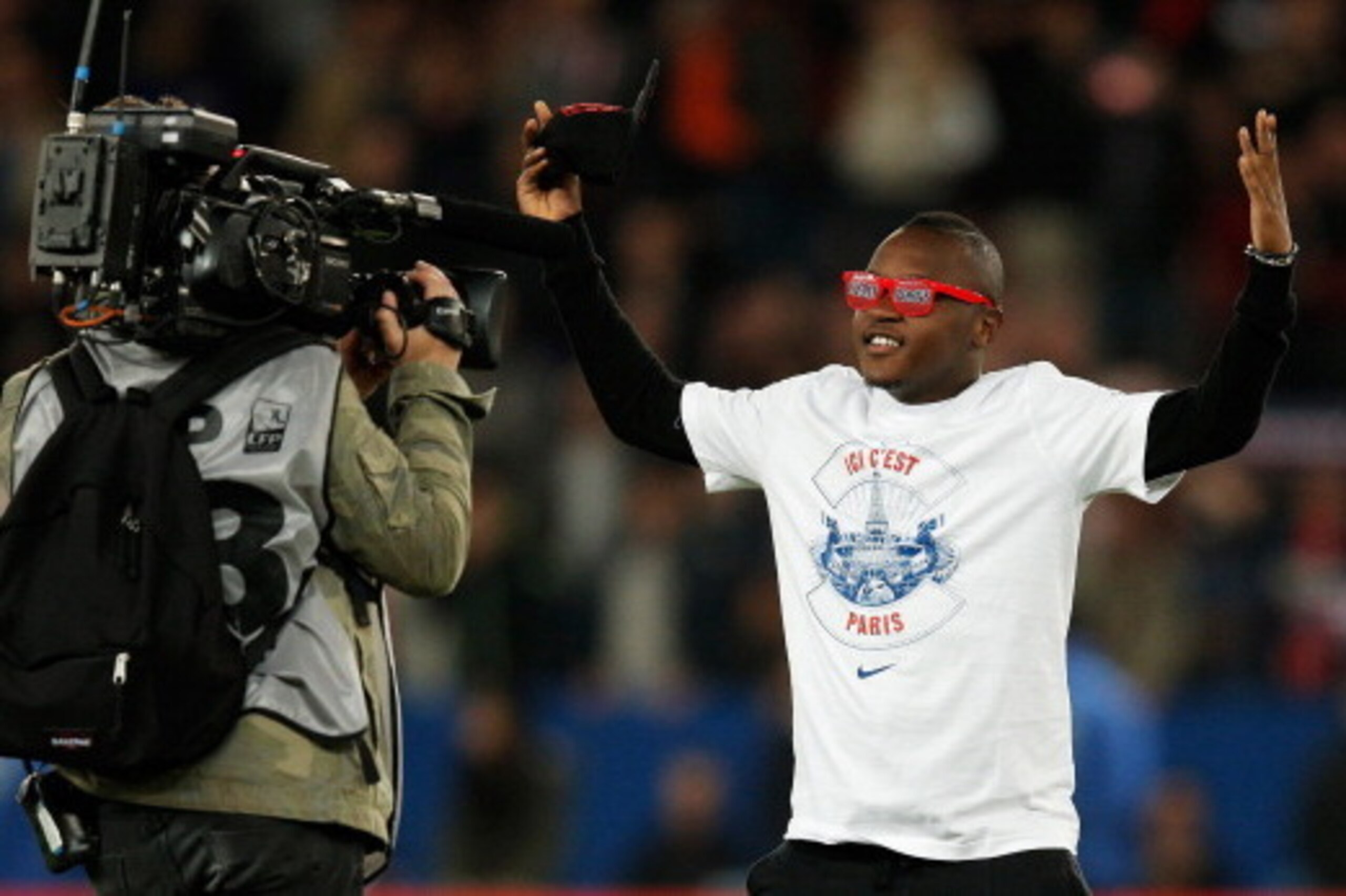 PARIS, FRANCE - MAY 07:  PSG player, Hervin Ongenda celebrates after the Ligue 1 match between Paris Saint-Germain FC and Stade Rennais FC at Parc des Princes on May 7, 2014 in Paris, France.  PSG lost the match 1-2 but still won the 2014 Ligue 1 Champion
