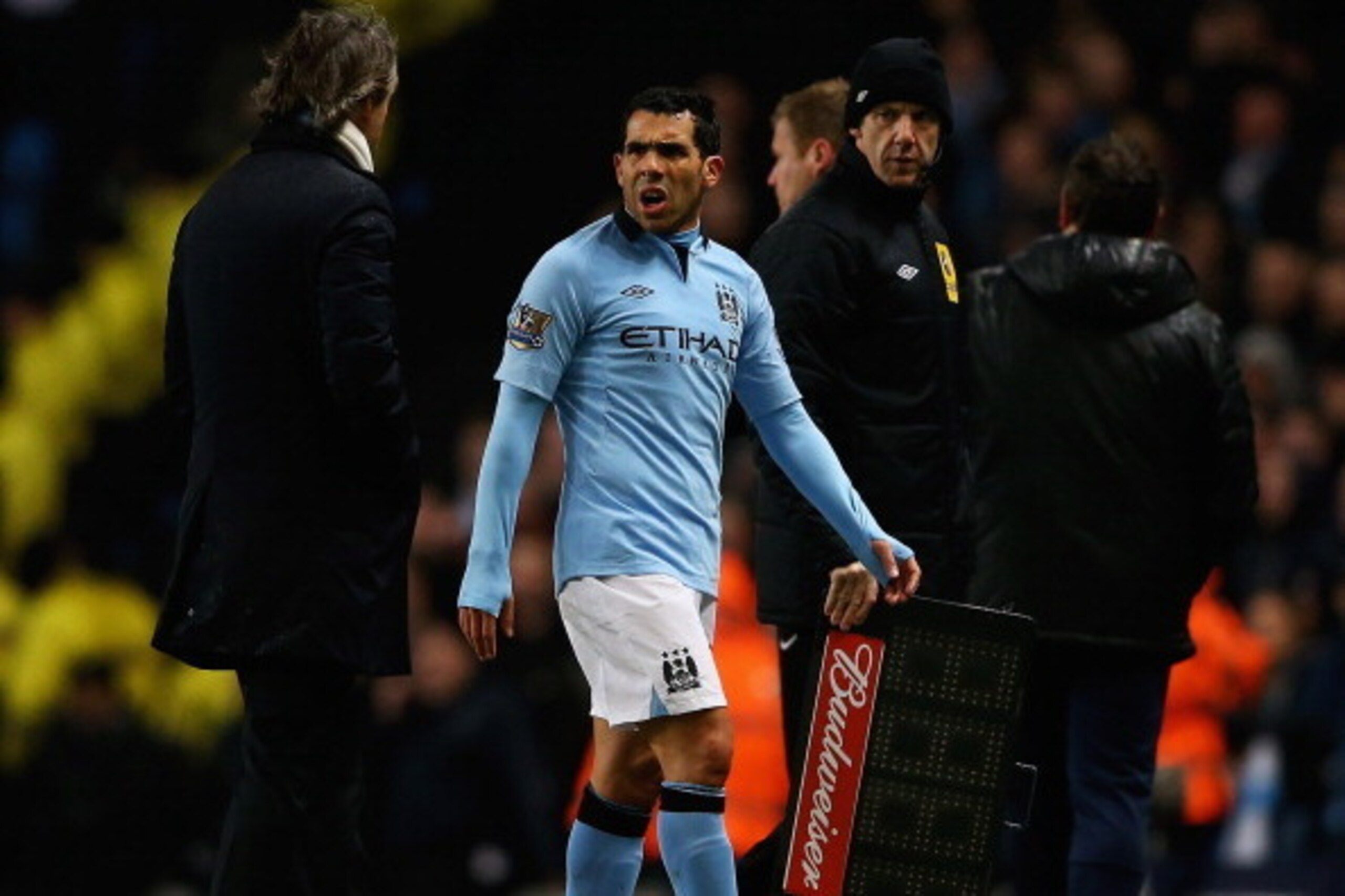 MANCHESTER, ENGLAND - MARCH 09: Carlos Tevez of Manchester City talks to Roberto Mancini, manager of Manchester City, after he was substituted during the FA Cup sponsored by Budweiser Sixth Round match between Manchester City and Barnsley at Etihad Stadi MANCHESTER, ENGLAND - MARCH 09: Carlos Tevez of Manchester City talks to Roberto Mancini, manager of Manchester City, after he was substituted during the FA Cup sponsored by Budweiser Sixth Round match between Manchester City and Barnsley at Etihad Stadi