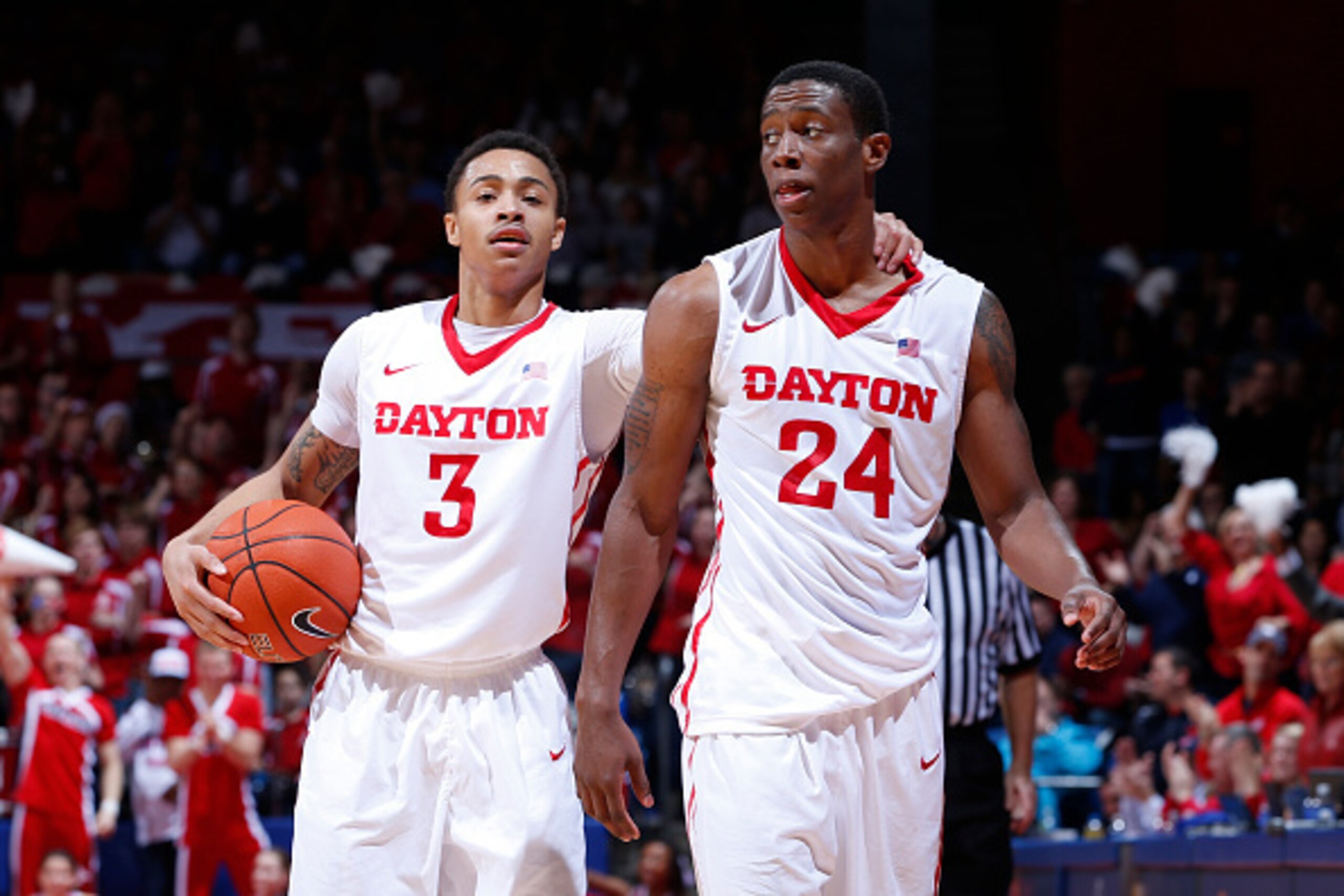 DAYTON, OH - DECEMBER 23: Kyle Davis #3 and Jordan Sibert #24 of the Dayton Flyers celebrate during the game against the Georgia Tech Yellow Jackets at UD Arena on December 23, 2014 in Dayton, Ohio. Dayton defeated Georgia Tech 75-61. (Photo by Joe Robbin