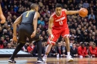Jan 6, 2015; Minneapolis, MN, USA; Ohio State Buckeyes guard D'Angelo Russell (0) looks past Minnesota Golden Gophers guard Andre Hollins (1) as he dribbles the ball in the first half at Williams Arena. Mandatory Credit: Jesse Johnson-USA TODAY Sports
