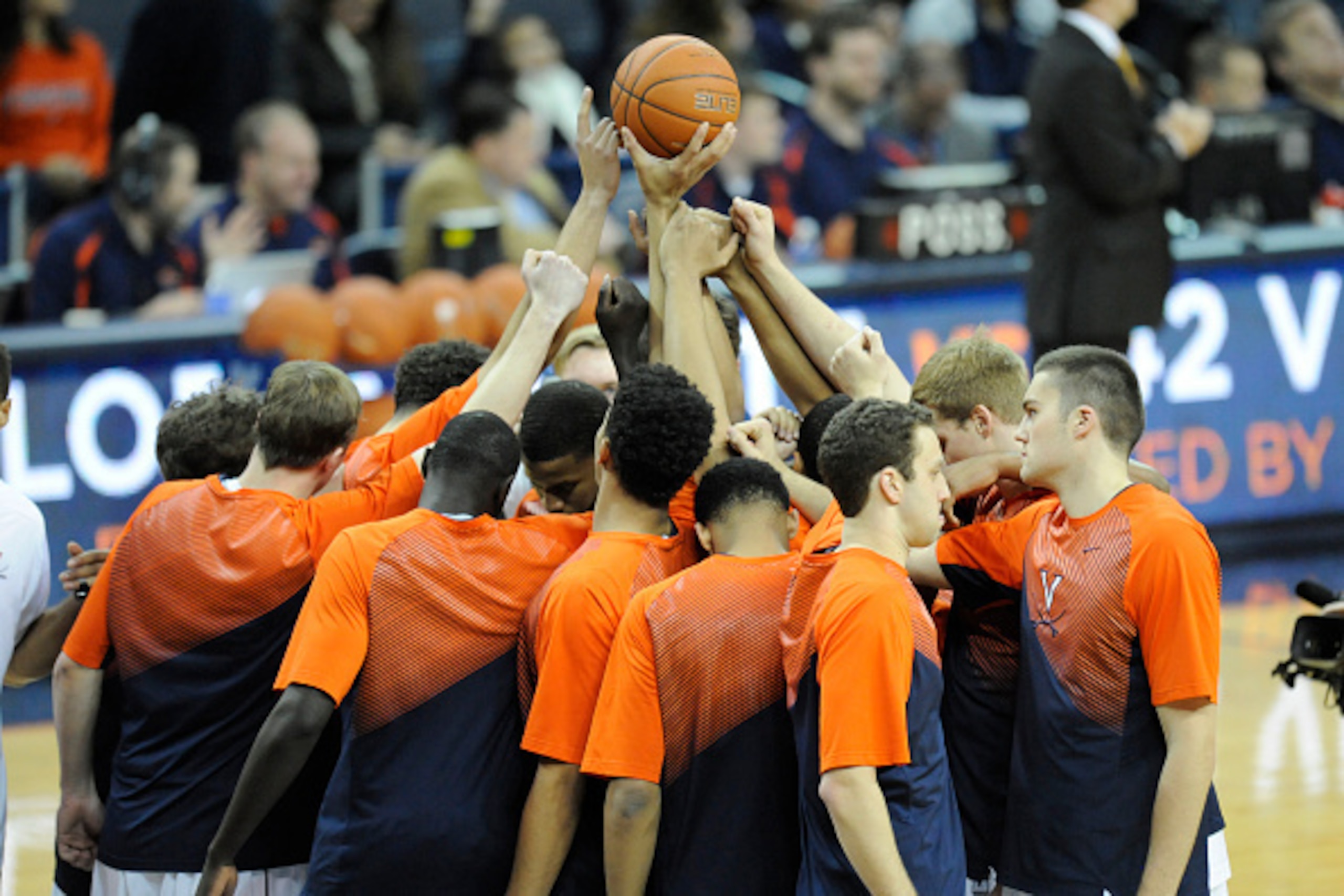 CHARLOTTESVILLE, VA - FEBRUARY 22:  The Virginia Cavaliers huddle before a college basketball game against the Florida State Seminoles at John Paul Jones Arena on February 22, 2015 in Charlottesville, Virginia.  The cavaliers won 51-41.  (Photo by Mitchel